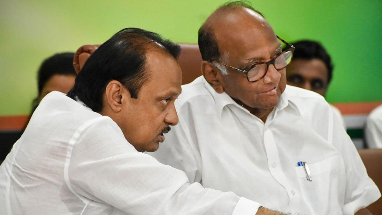 <div class="paragraphs"><p>Ajit Pawar (left) with Sharad Pawar.</p></div>