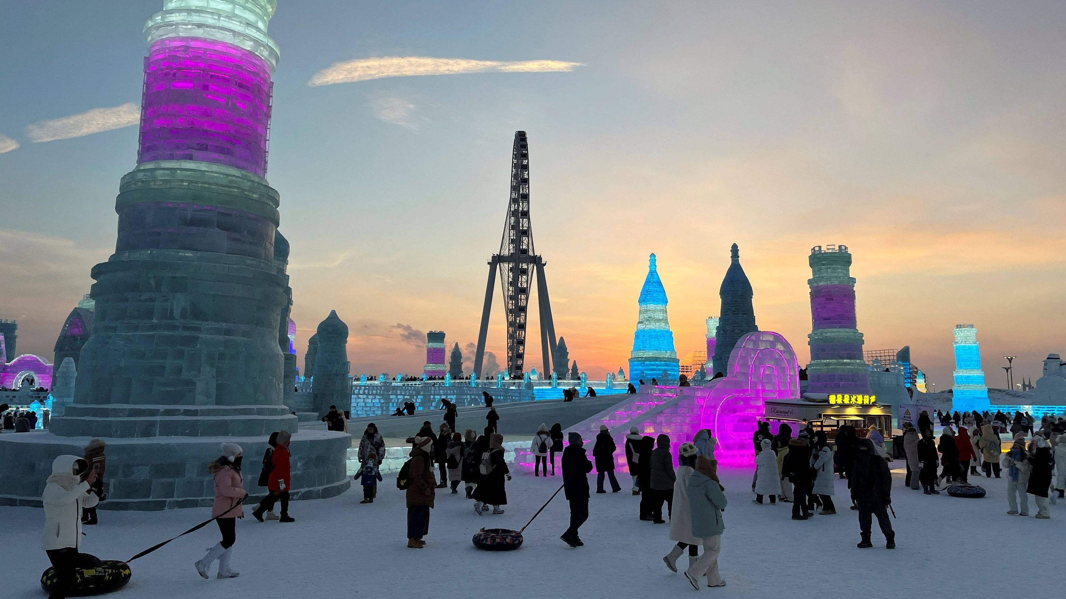 <div class="paragraphs"><p>Visitors walk past ice sculptures at the Harbin Ice and Snow Festival in Harbin, Heilongjiang province, China December 24, 2023. </p></div>