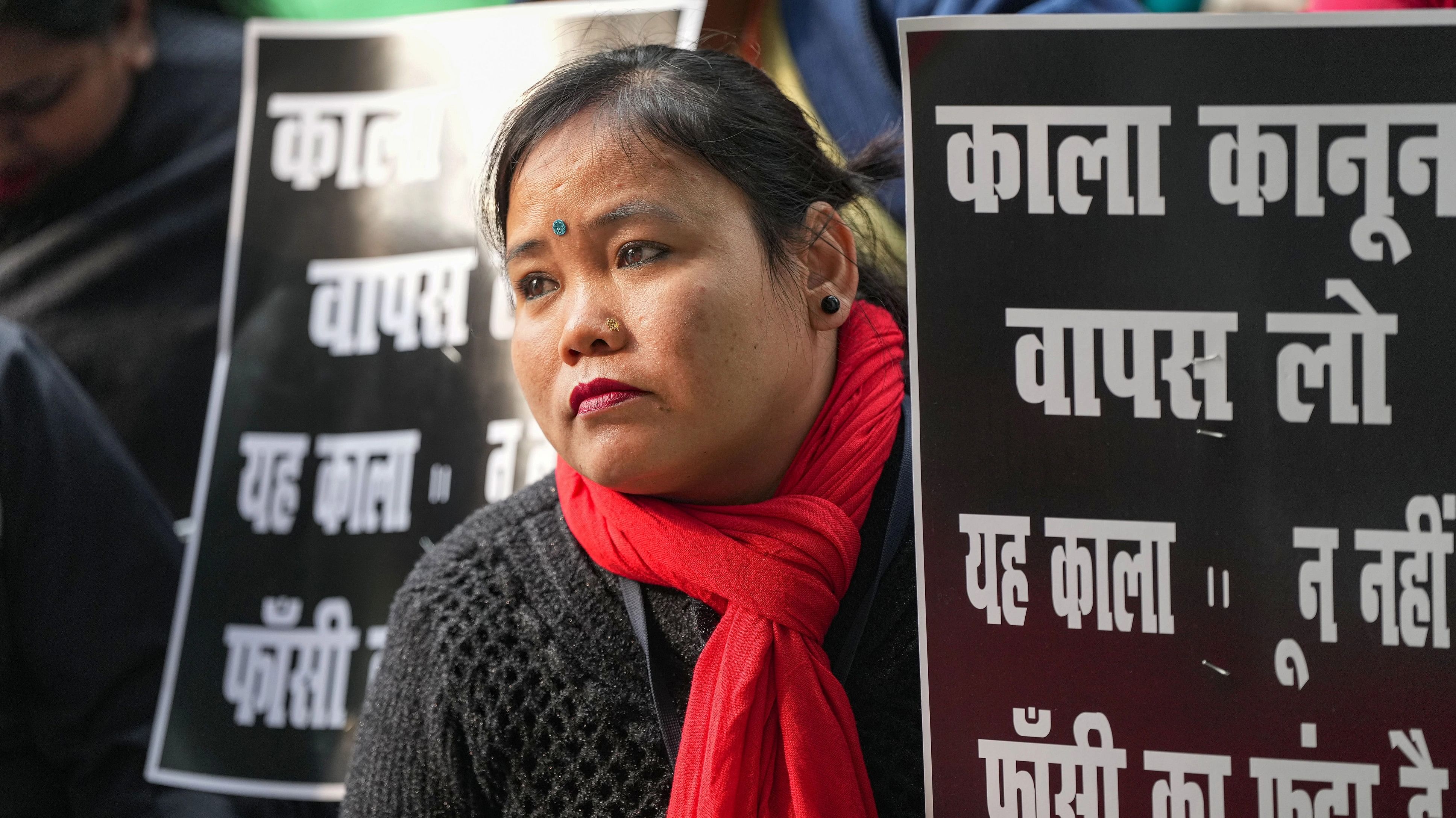 <div class="paragraphs"><p>A women driver holds a placard during the Transport Unions protest against the new penal law on hit-and-run cases, at Jantar Mantar, in New Delhi, Wednesday, Jan. 3, 2024. </p></div>