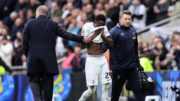 <div class="paragraphs"><p>Tottenham Hotspur's Pape Matar Sarr with manager Ange Postecoglou after being substituted off after sustaining an injury, at Tottenham Hotspur Stadium, London, Britain on&nbsp; December 31, 2023</p></div>