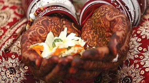 <div class="paragraphs"><p>Indian bride's hands decorated with traditional henna designs. For representation only.&nbsp;</p></div>