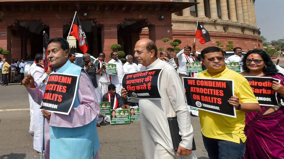 <div class="paragraphs"><p>TMC members protest against atrocities on Dalits.</p></div>