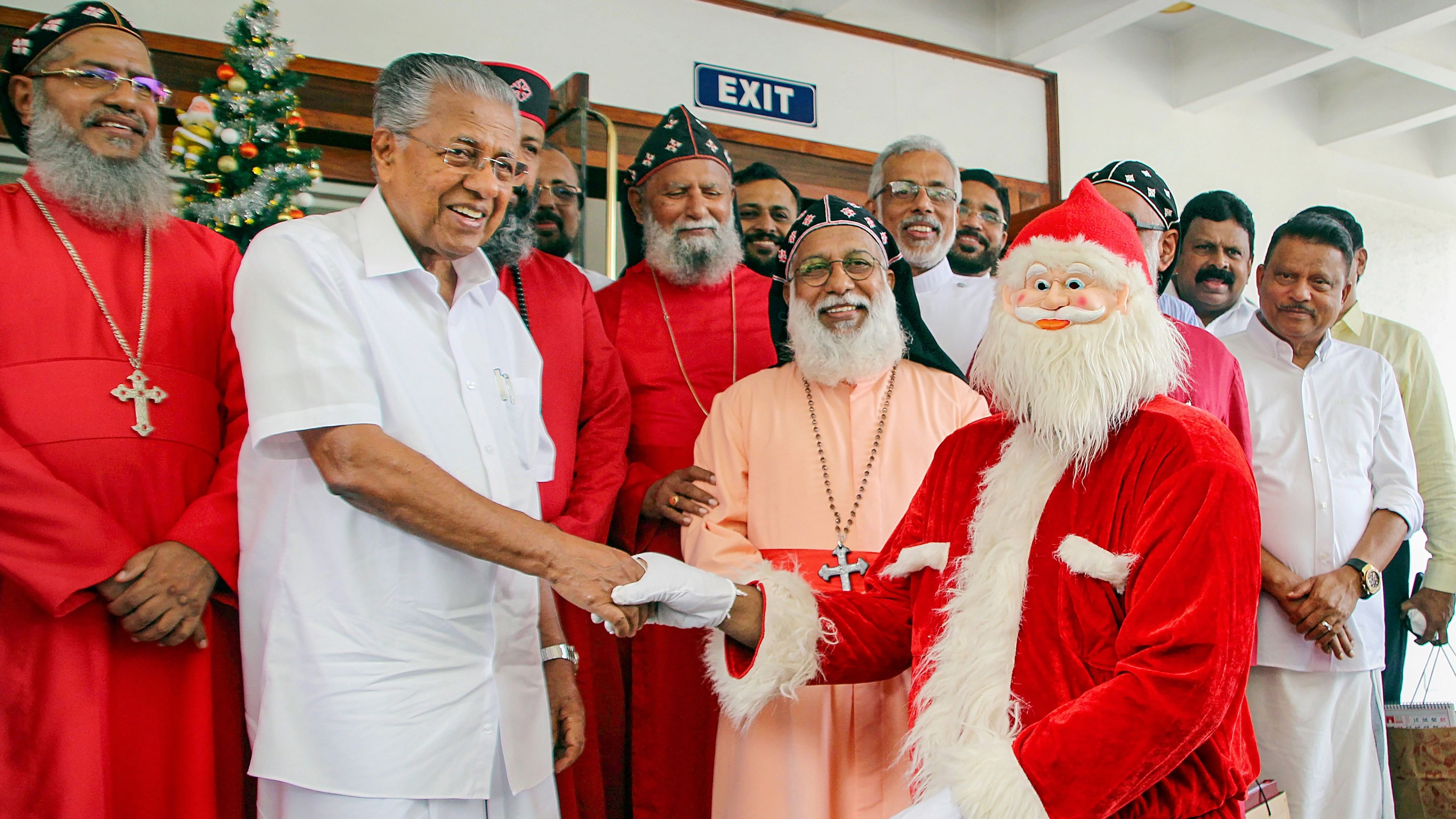 <div class="paragraphs"><p>Kerala Chief Minister Pinarayi Vijayan greets a man dressed as Santa Claus during the Christmas-New Year lunch hosted in Thiruvananthapuram.</p></div>