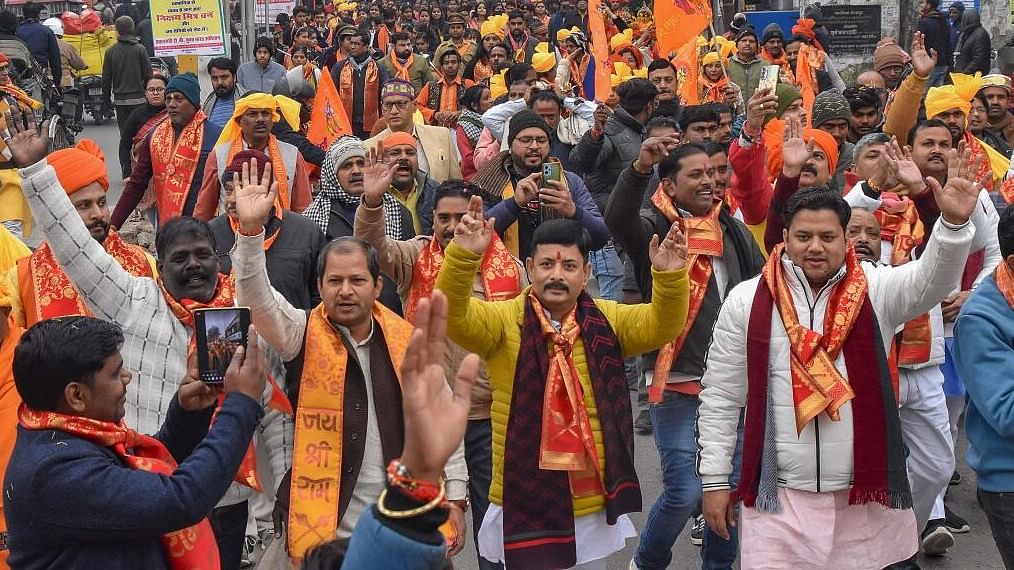 <div class="paragraphs"><p>People take part in a religious procession, ahead of Shri Ram Janmabhoomi Temple consecration ceremony, in Gorakhpur,</p></div>