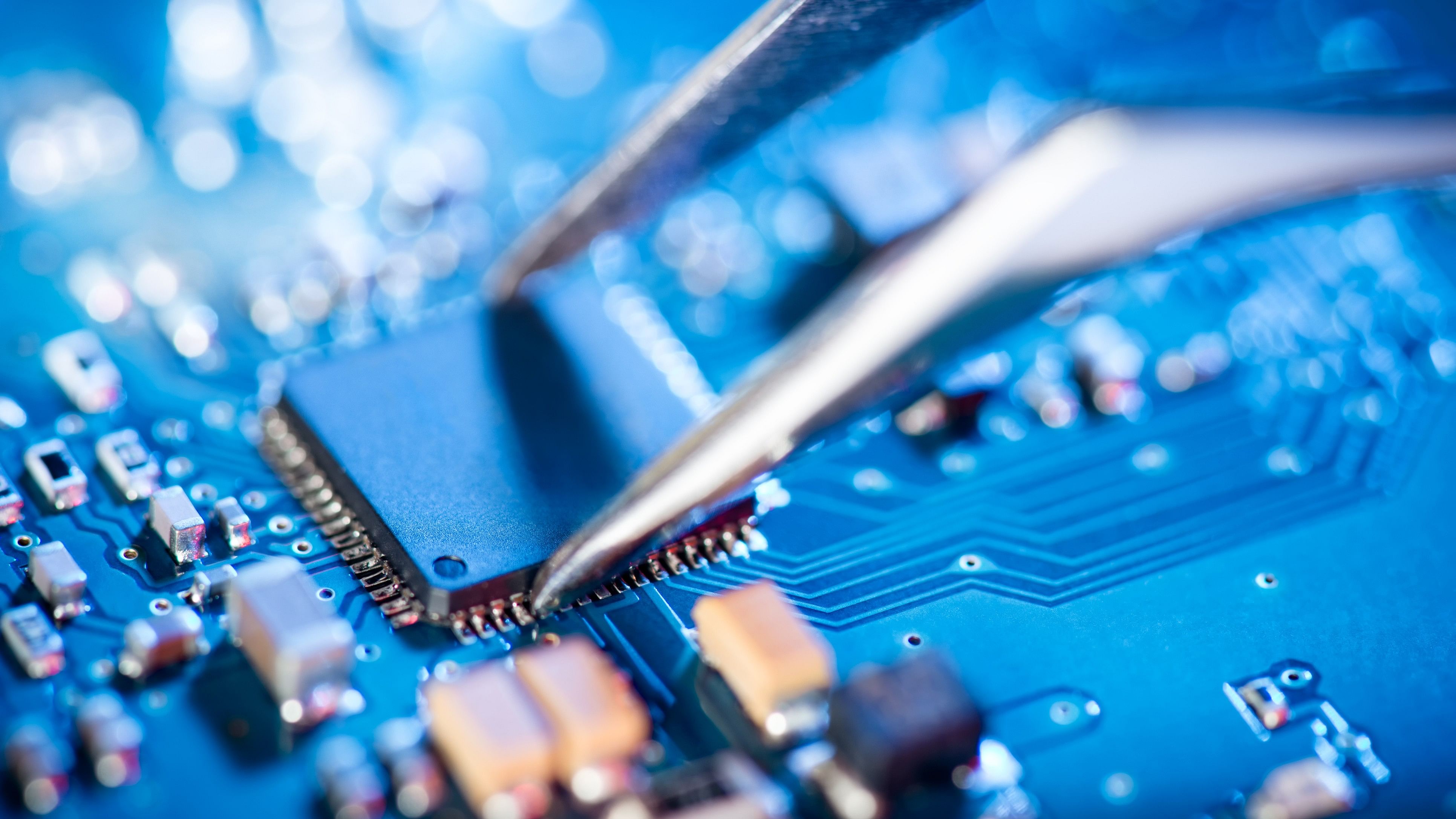 <div class="paragraphs"><p>Representative image of a technician assembling a circuit board.</p></div>