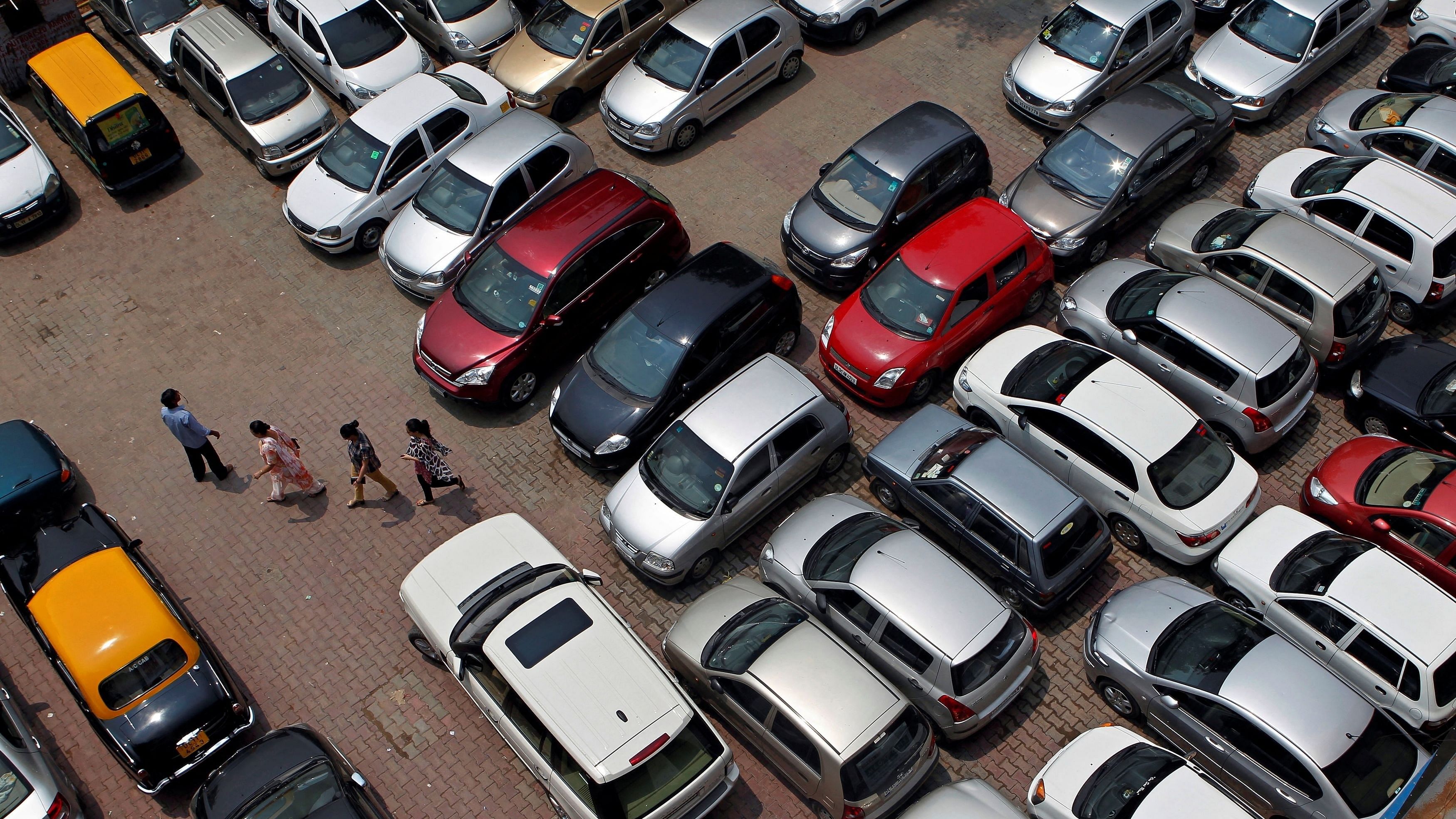 <div class="paragraphs"><p>People walk through a car parking lot in New Delhi. (Representative image)</p></div>