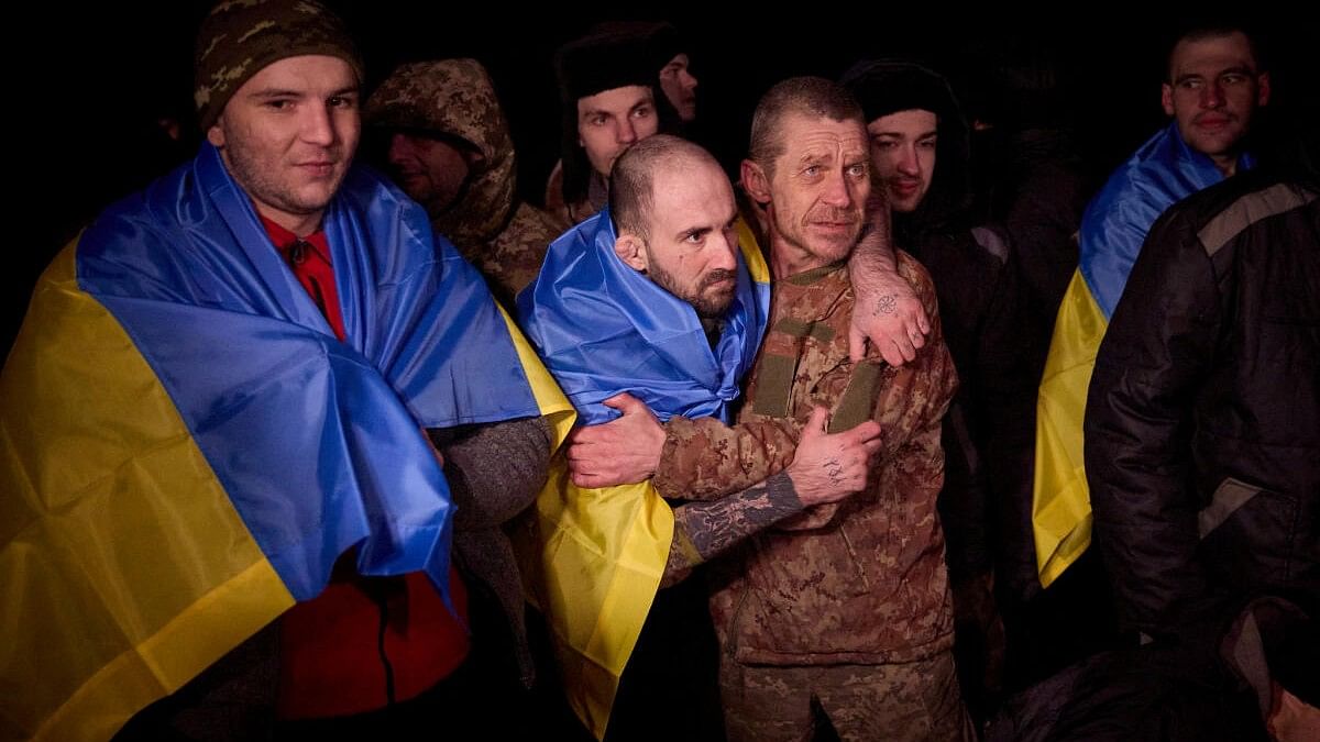 <div class="paragraphs"><p>Ukrainian prisoners of war (POWs) react after a swap, amid Russia's attack on Ukraine, at an unknown location in Ukraine, in this handout picture released January 3, 2024.</p></div>