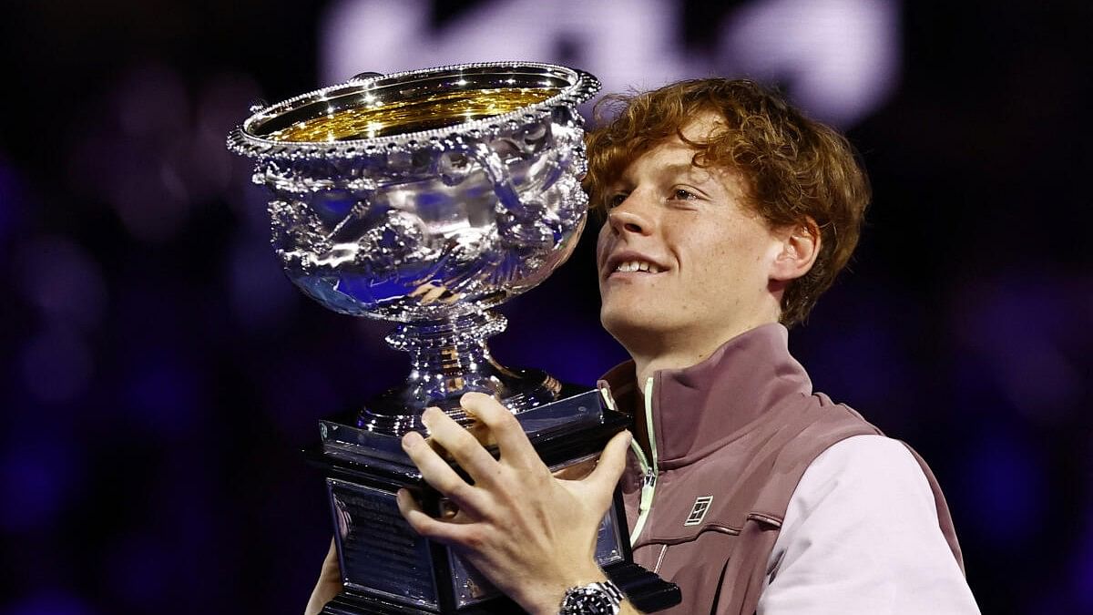 <div class="paragraphs"><p>Italy's Jannik Sinner celebrates with the trophy after winning the final against Russia's Daniil Medvedev.</p></div>