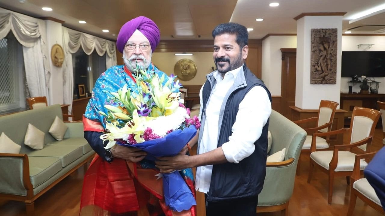 <div class="paragraphs"><p>Telangana Chief Minister A Revanth Reddy with Urban Affairs Minister Hardeep Singh Puri</p></div>