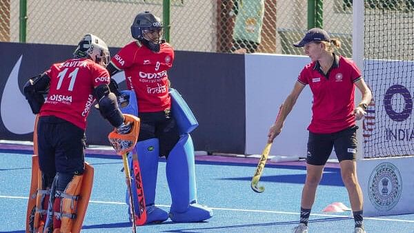 <div class="paragraphs"><p>Indian women's hockey team captain Savita Punia with teammate Bichu Devi Kharibam and head coach Janneke Schopman during a training session.</p></div>