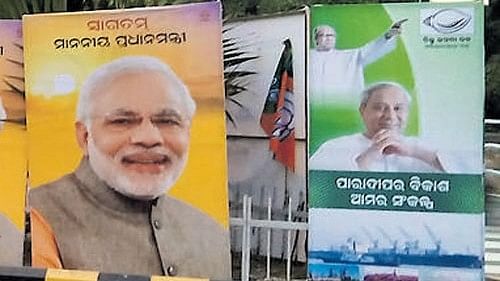 <div class="paragraphs"><p>A poster with the photos of Prime Minister Narendra Modi and Odisha CM Naveen Patnaik.</p></div>