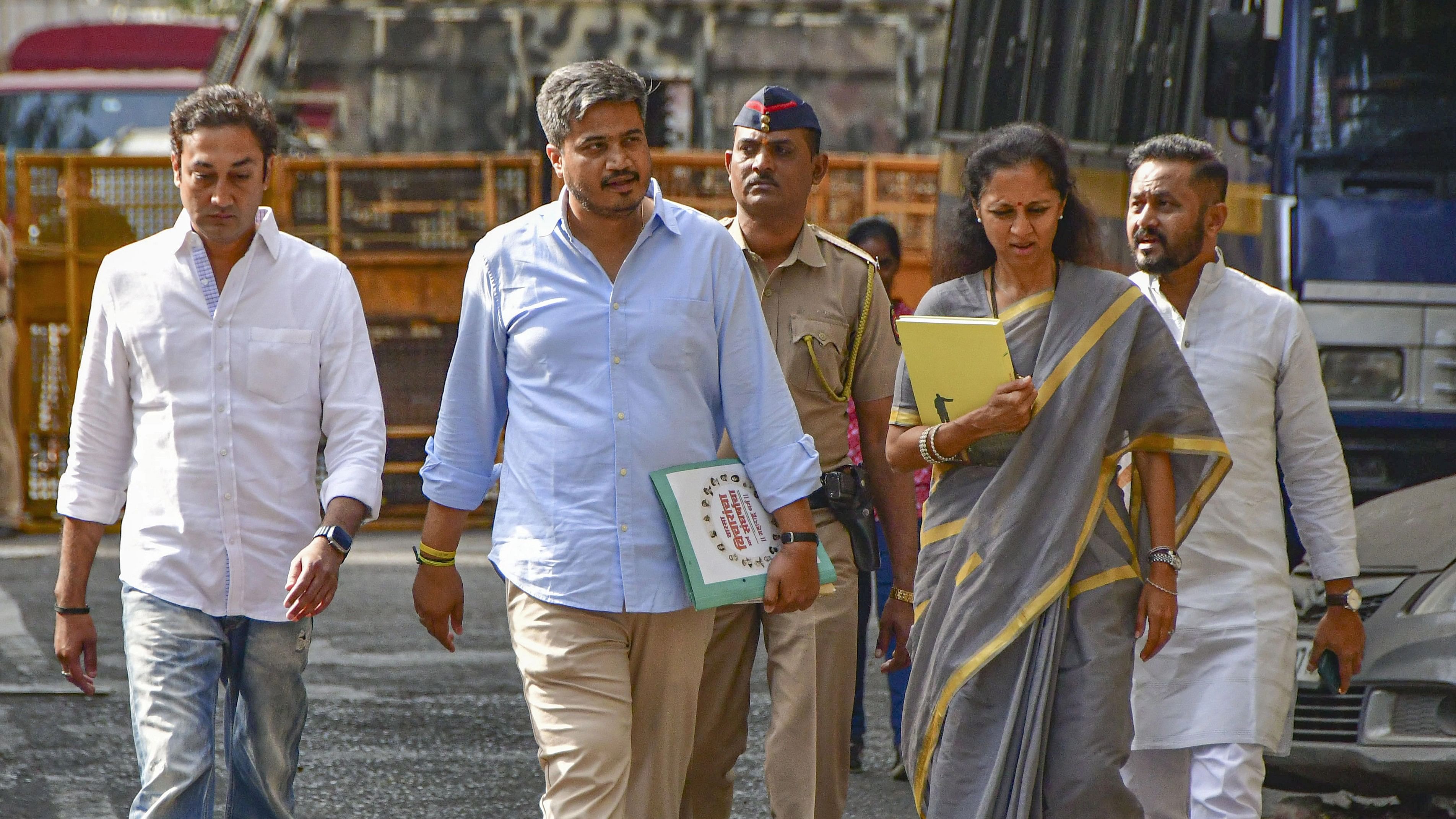 <div class="paragraphs"><p>NCP MLA Rohit Pawar with party MP Supriya Sule arrives at the Directorate of Enforcement (ED) office for questioning in connection with its money laundering probe into the alleged Maharashtra State Cooperative Bank scam.</p></div>