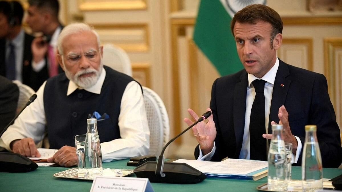 <div class="paragraphs"><p>France's President Emmanuel Macron speaks as India's Prime Minister Narendra Modi looks on.</p></div>