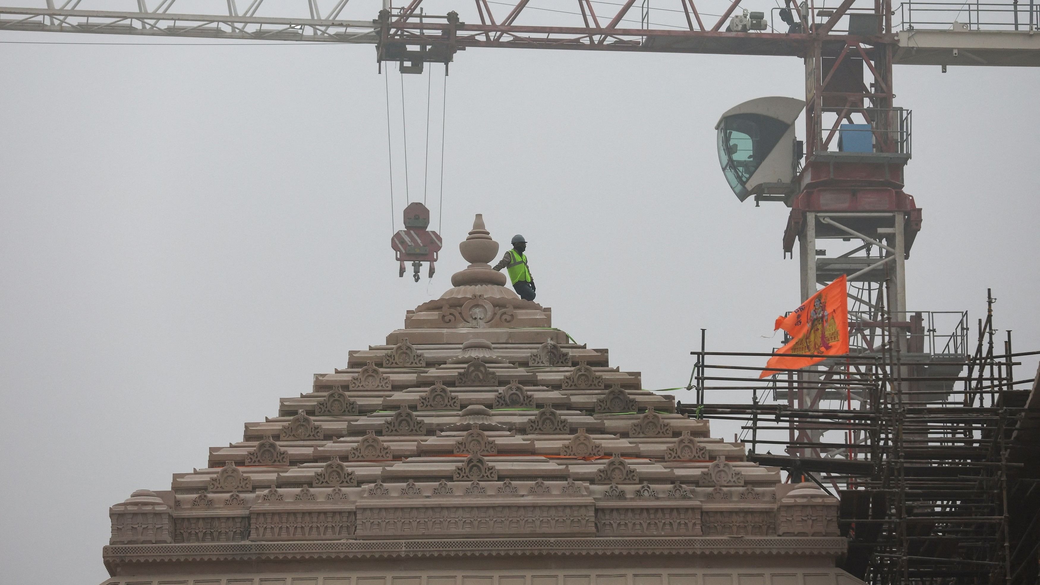 <div class="paragraphs"><p>A worker stands on a stone structure being carved at the under construction site of the Hindu Ram Temple in Ayodhya, India.</p></div>