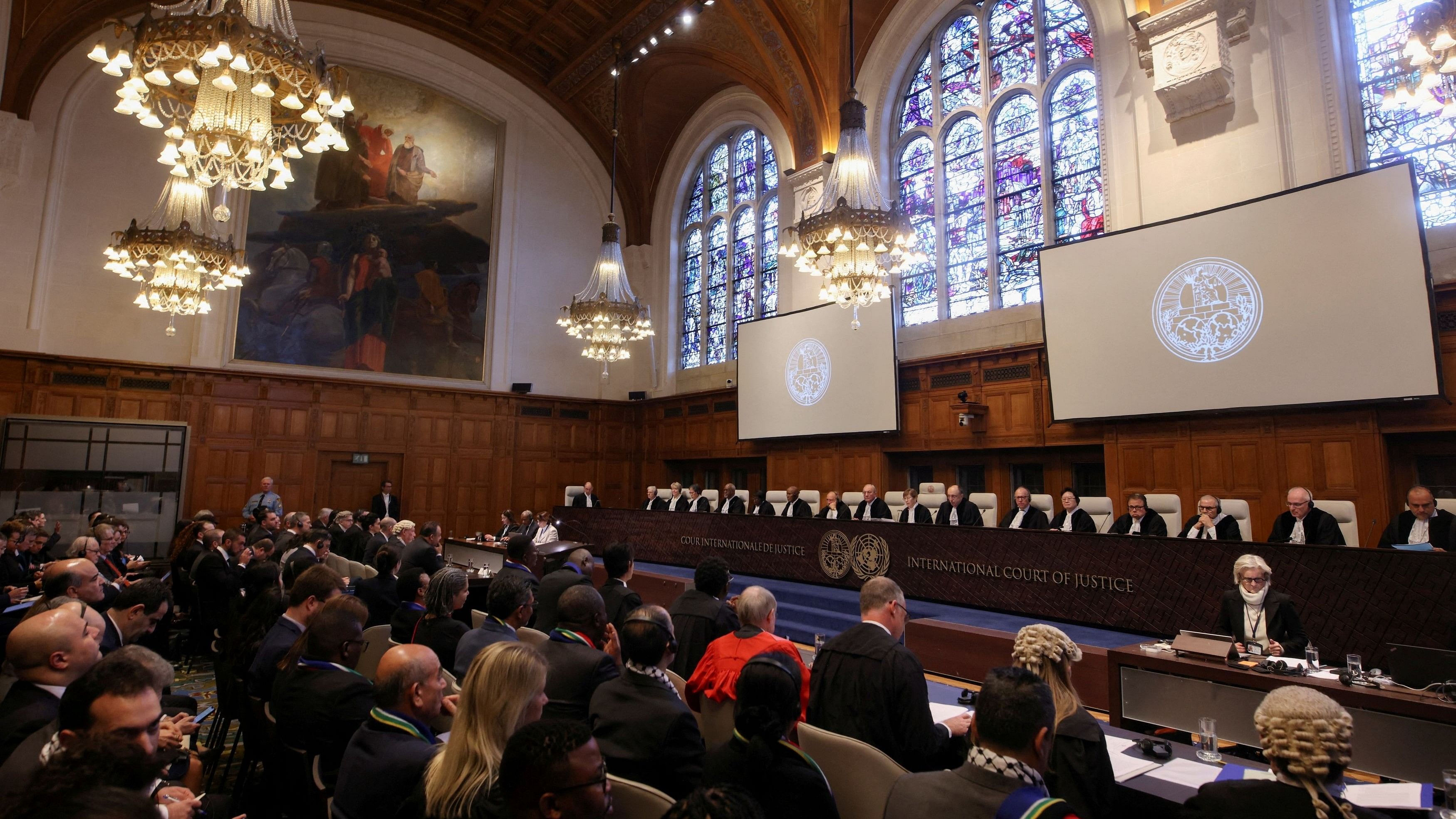 <div class="paragraphs"><p>People sit inside the International Court of Justice  on the day of the trial to hear a request for emergency measures by South Africa.</p></div>