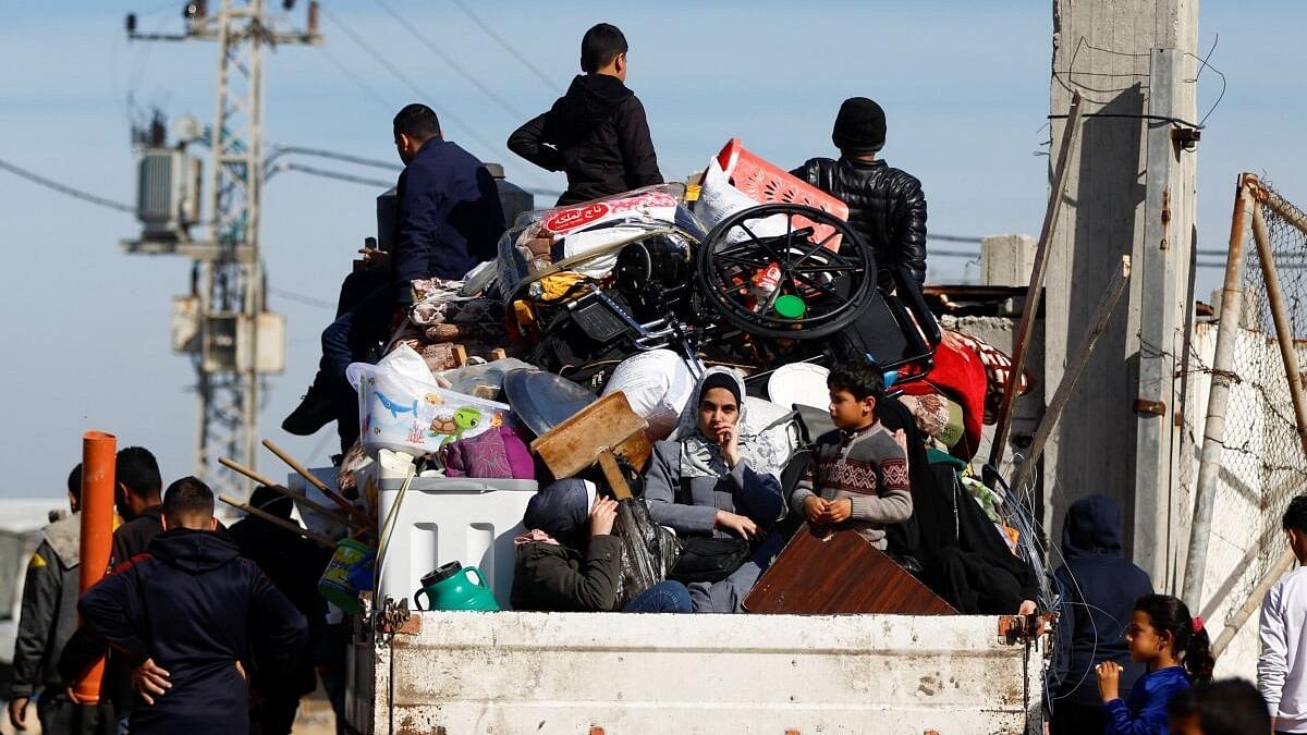 <div class="paragraphs"><p>Displaced Palestinians, who fled their houses due to Israeli strikes, ride a vehicle in Rafah in the southern Gaza Strip, January 8, 2024.</p></div>