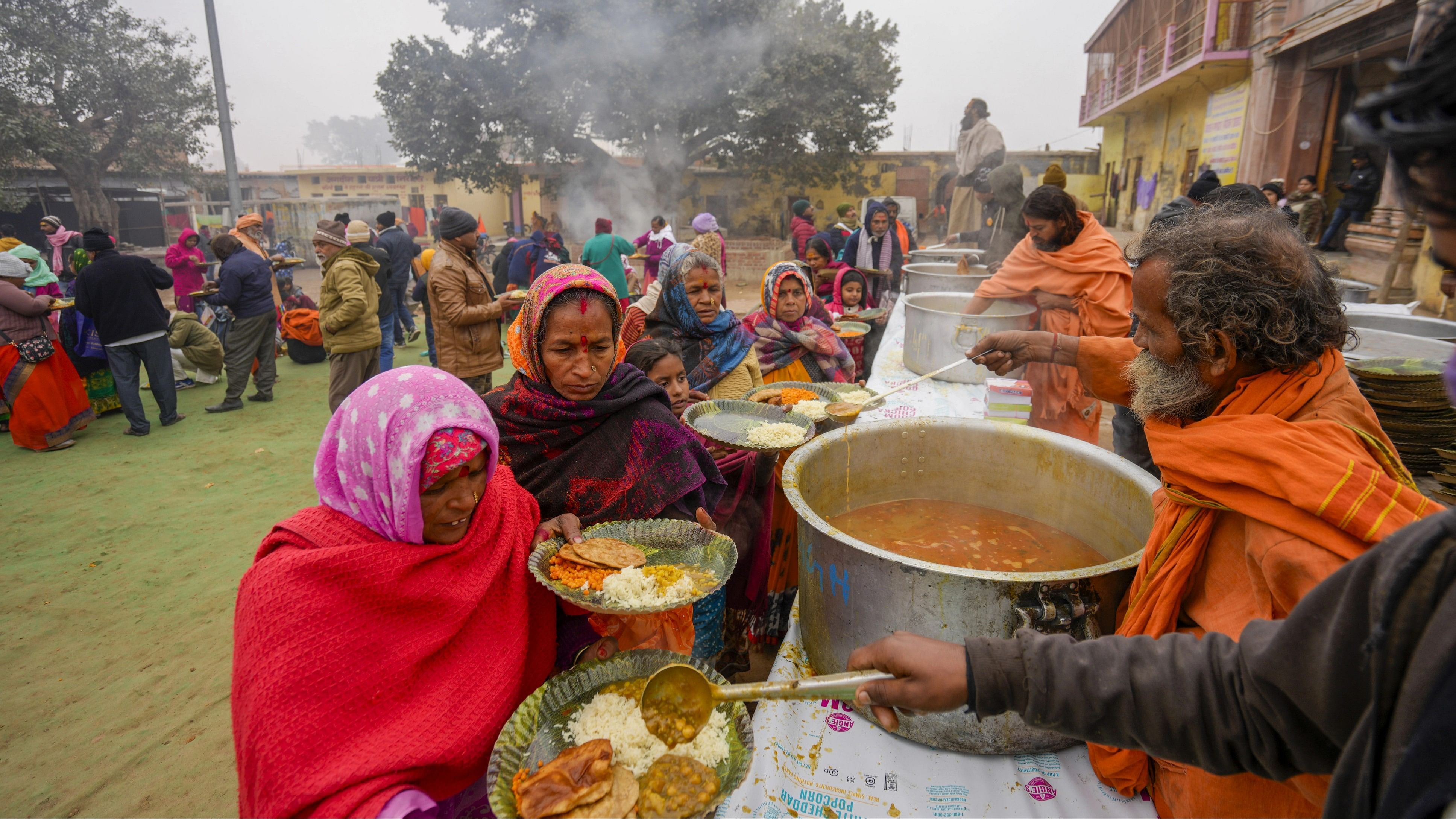 <div class="paragraphs"><p>Devotees being served food at Dashrath Bhawan ahead of the consecration ceremony of Shri Ram Janmabhoomi Temple, in Ayodhya, Tuesday, Jan. 16, 2024. </p></div>