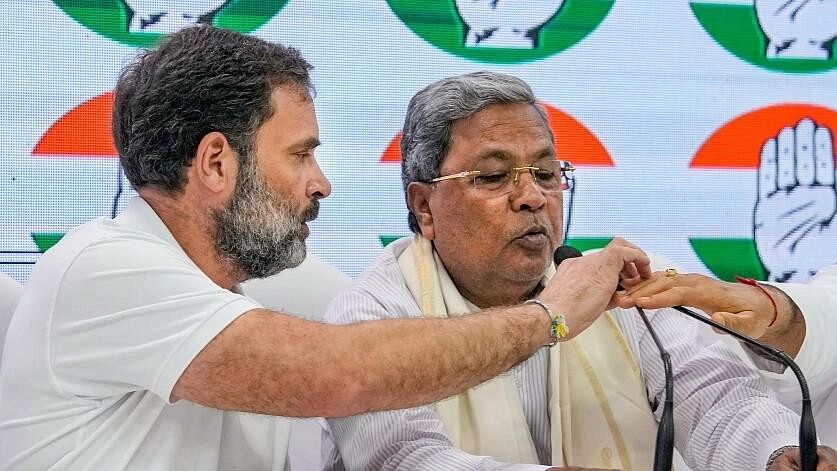 <div class="paragraphs"><p>File Photo: Congress leader Rahul Gandhi with Karnataka CM Siddaramaiah</p></div>