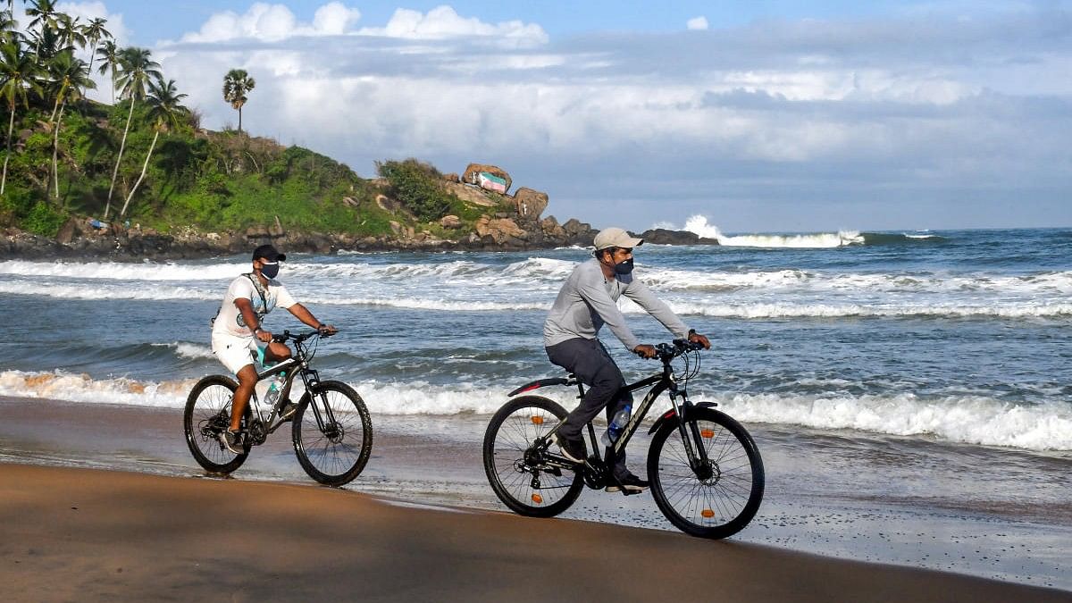 <div class="paragraphs"><p>Representative image of tourists at a beach in&nbsp;Thiruvananthapuram.</p></div>