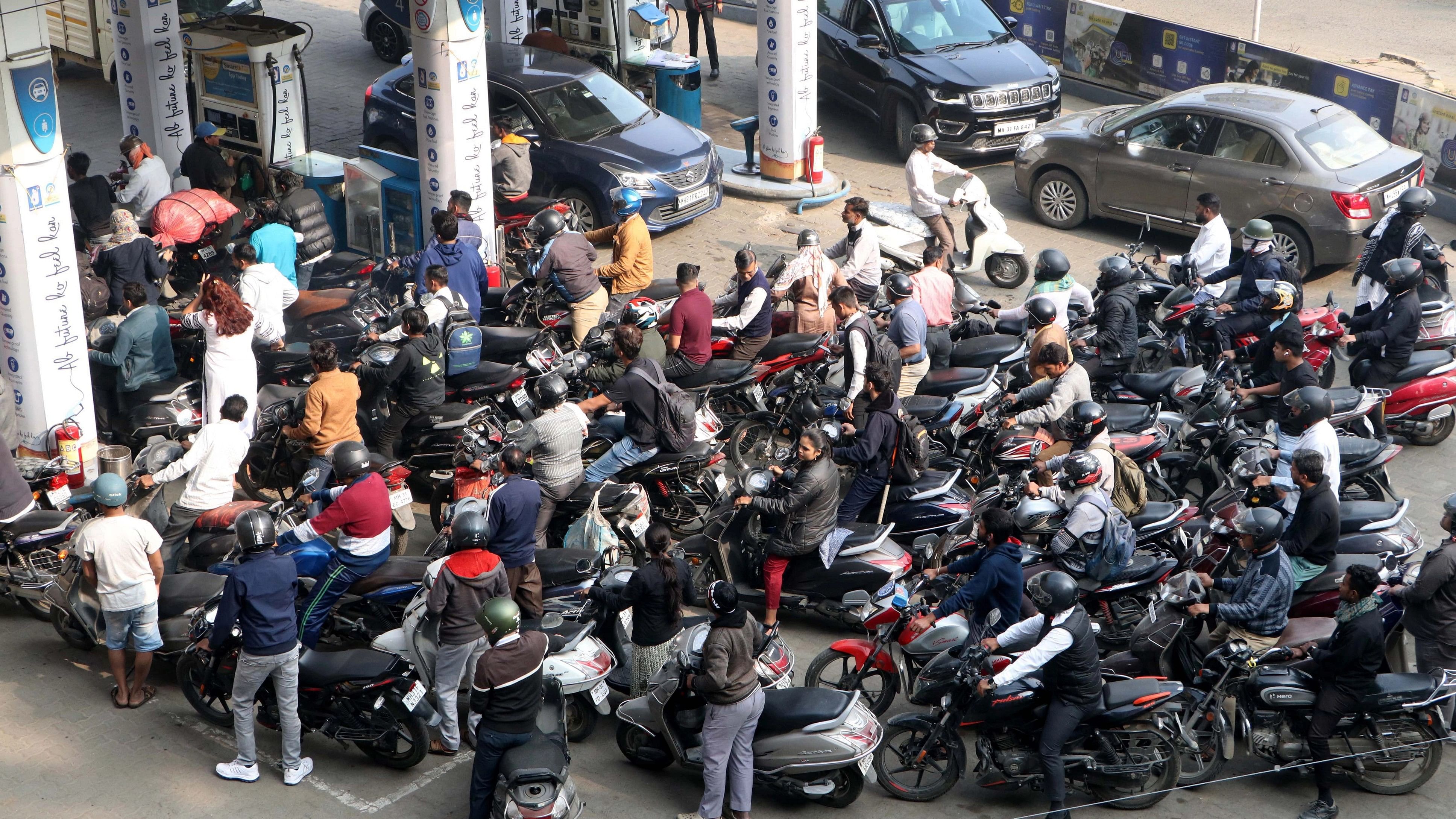 <div class="paragraphs"><p>People wait in a long queue to get fuel as truckers protest against the provision in the new penal law regarding hit-and-run road accident cases involving motorists.</p></div>