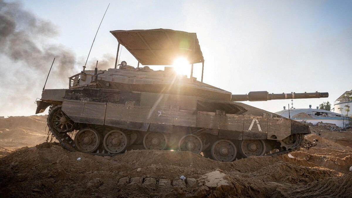 <div class="paragraphs"><p>Israeli soldiers operate a tank in the Gaza Strip, amid the ongoing conflict between Israel and the Palestinian Islamist group Hamas, in this handout picture released on January 20, 2024</p></div>