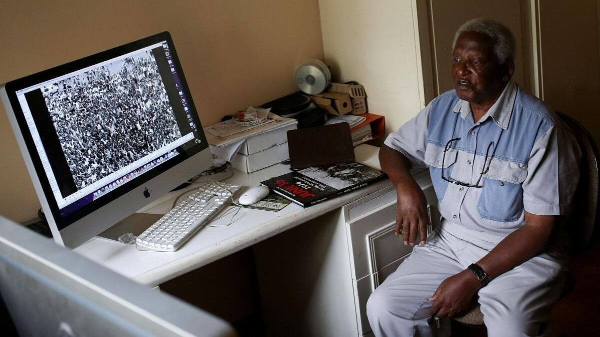 <div class="paragraphs"><p>Veteran photojournalist doctor Peter Magubane looks on as he takes a break from editing pictures at his home in Johannesburg, South Africa, February 10, 2016.</p></div>