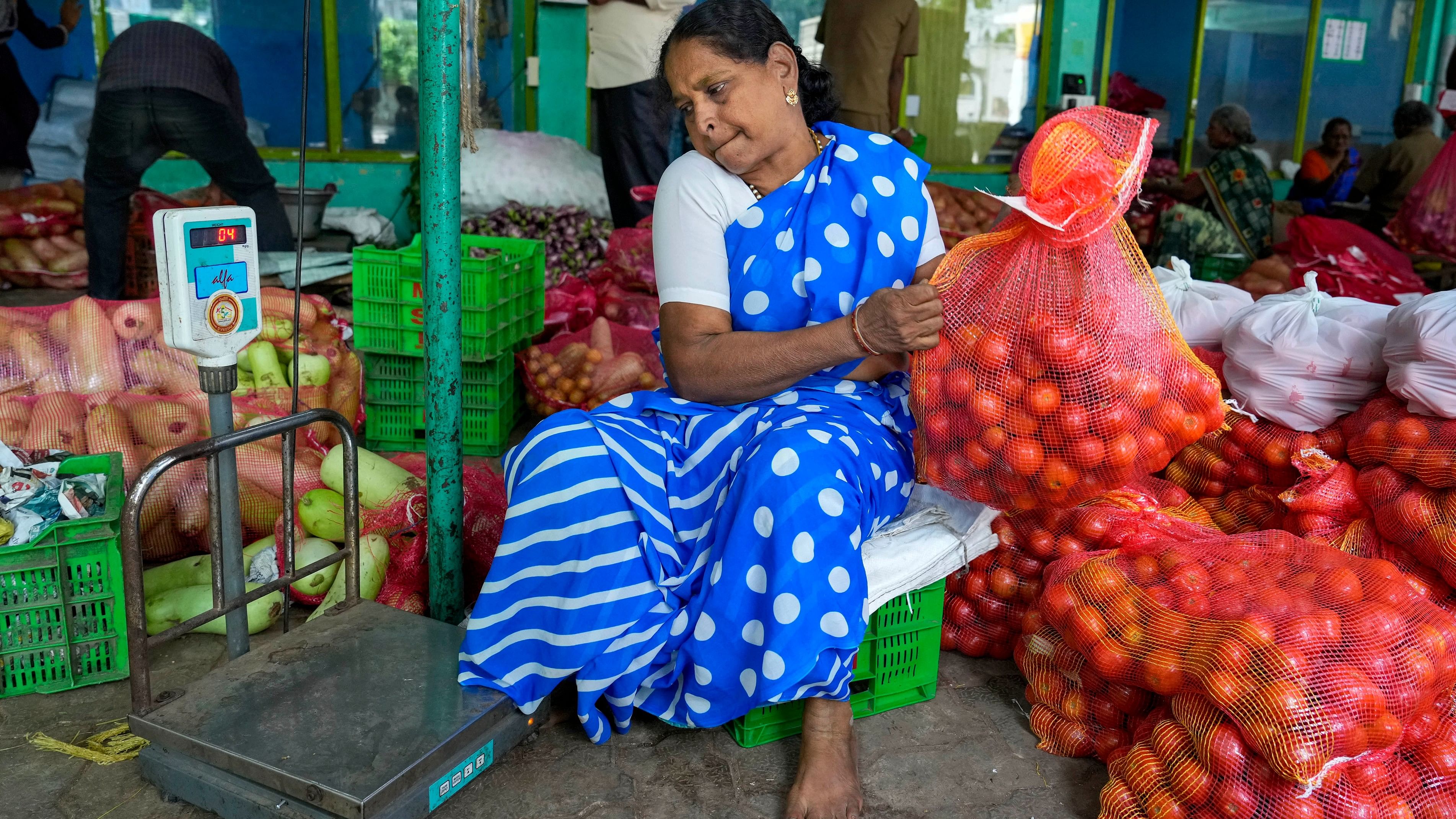 <div class="paragraphs"><p>Representative image showing piles of tomatoes to be dispatched to fair price shops.</p></div>