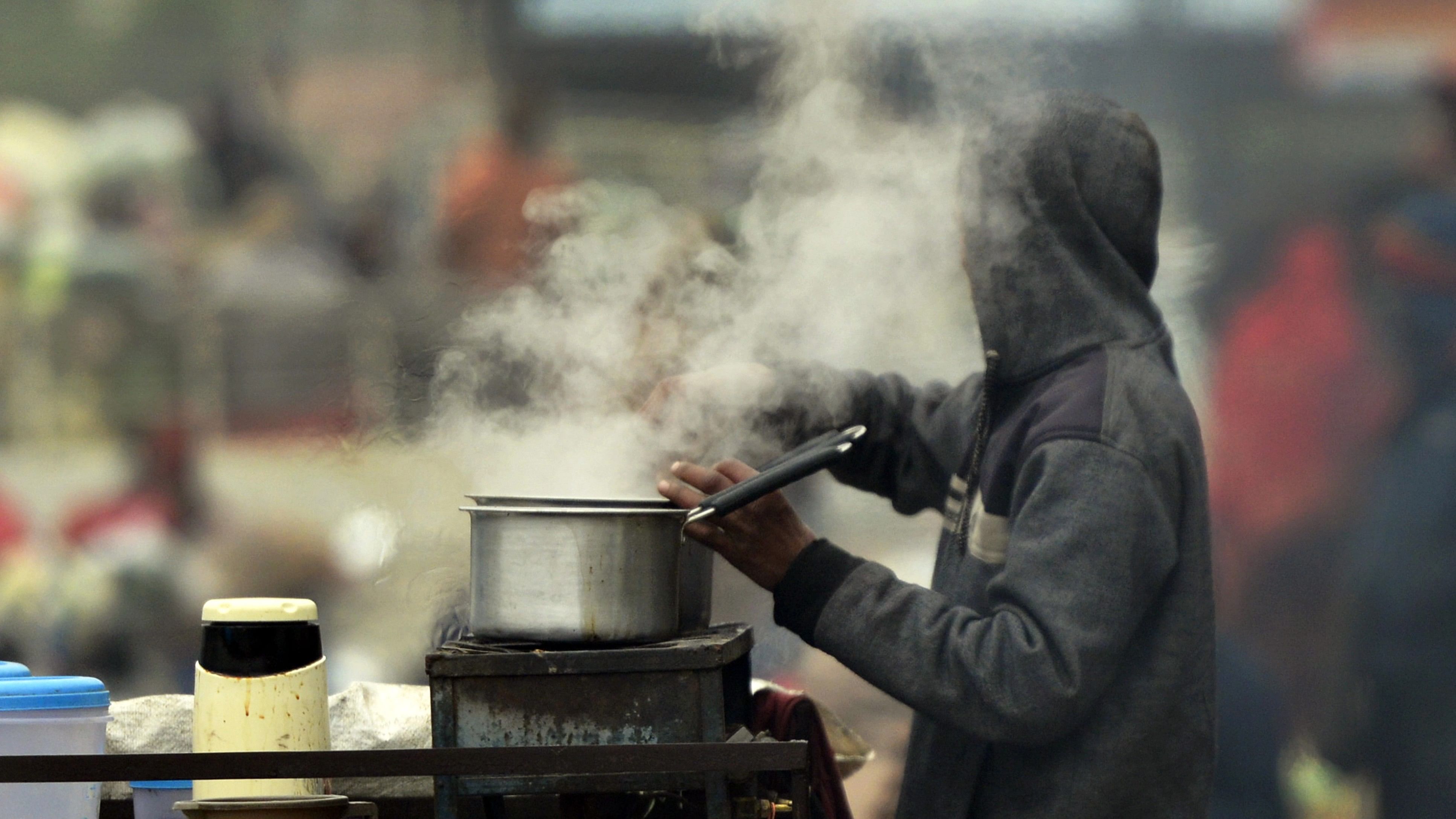 <div class="paragraphs"><p>A vendor prepares tea for customers during a cold winter day, at a wholesale vegetable market in Jalandhar</p></div>