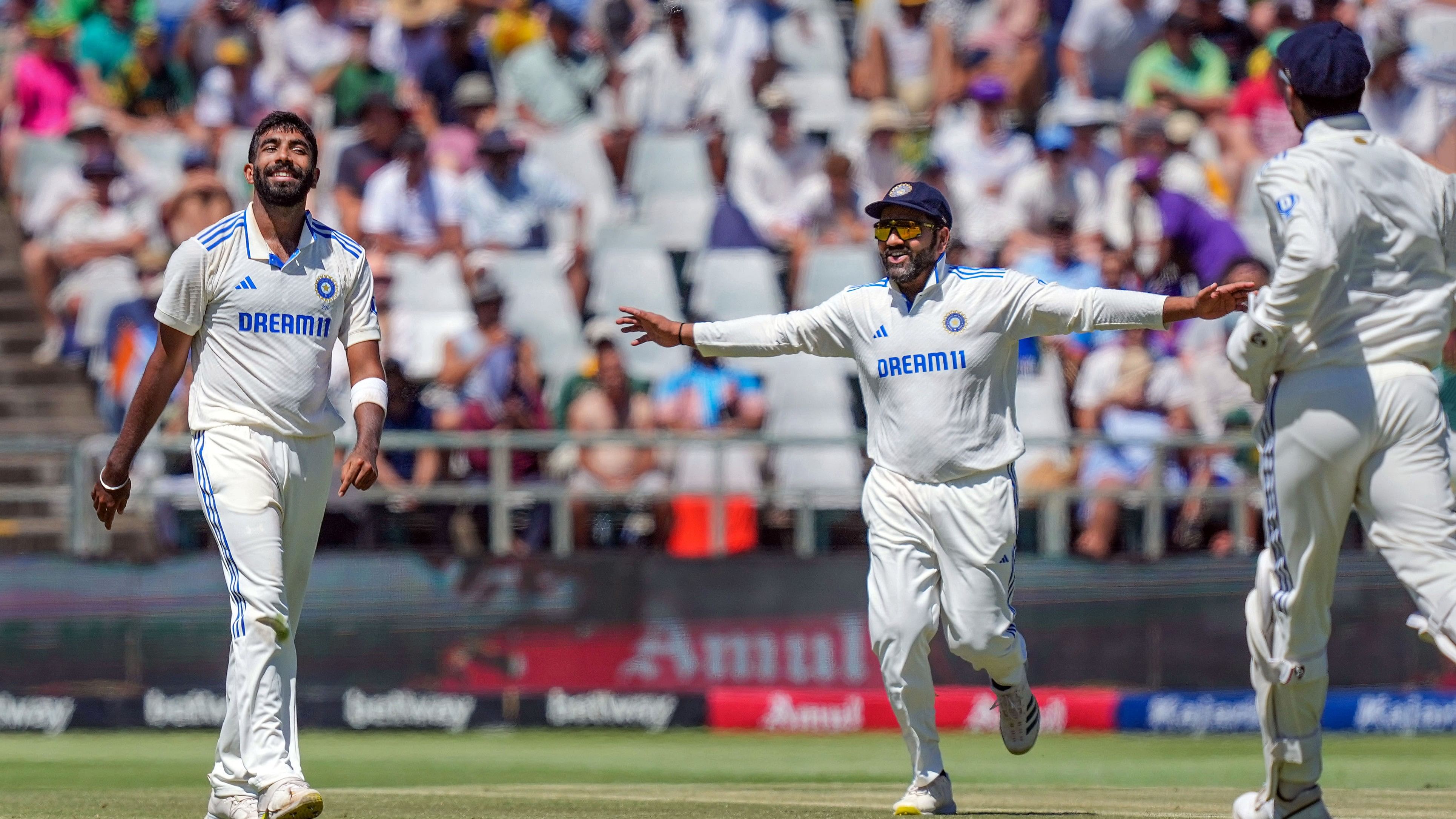 <div class="paragraphs"><p> Jasprit Bumrah and Rohit Sharma celebrate the wicket of David Bedingham during the second day of the second Test match between India and South Africa, at the Newlands Cricket Ground, in Cape Town, Jan 4, 2024.</p></div>