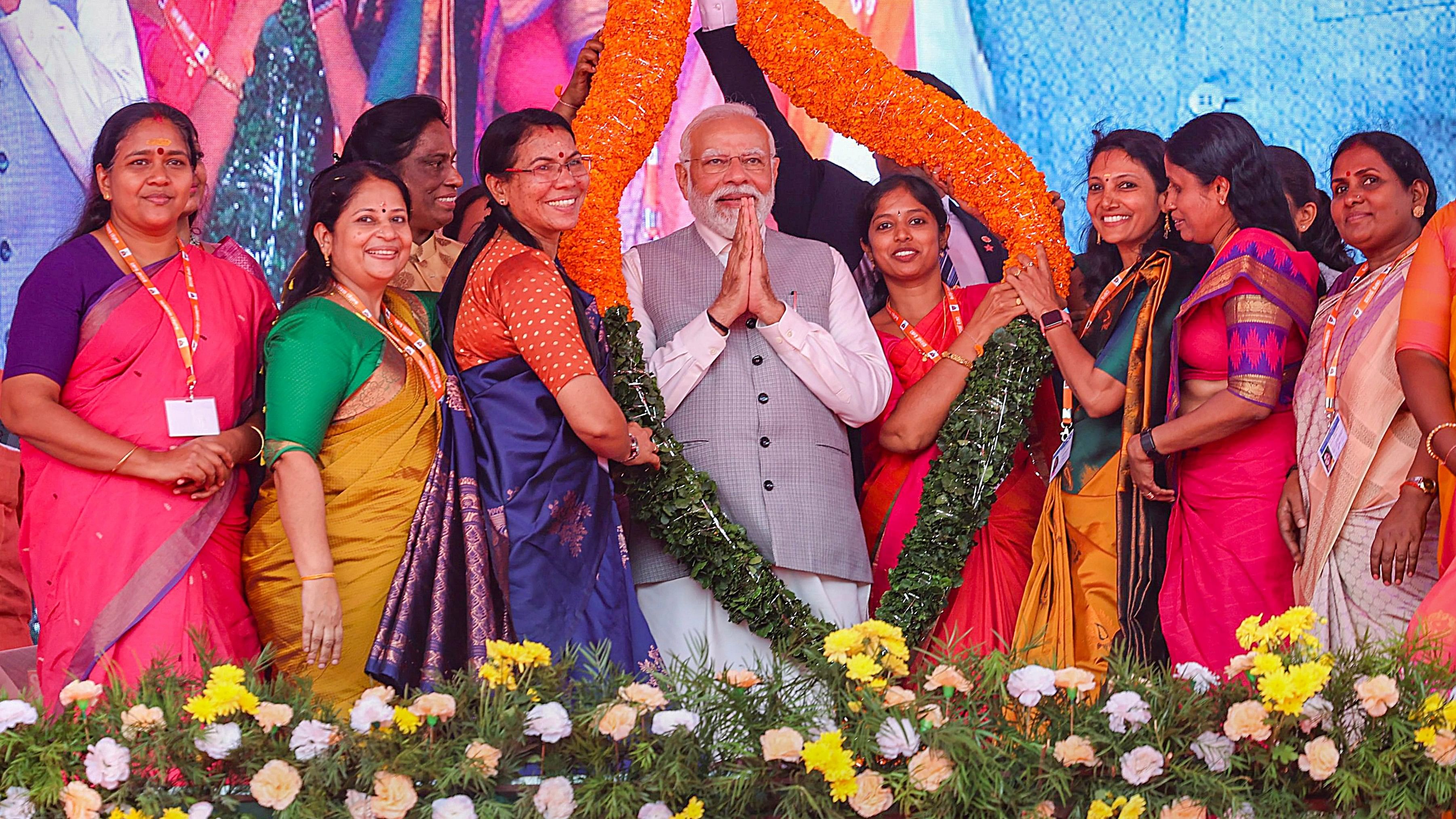 <div class="paragraphs"><p>Prime Minister Narendra Modi being garlanded during a BJP-organised women's convention 'Sthree Shakthi Modikkoppam' (Empowered Women with Modi), in Thrissur, Wednesday, Jan. 3, 2024.</p></div>