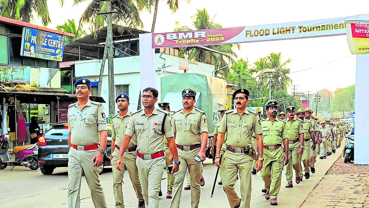 Police carry out route marches in Mangaluru police commissionerate limits on Sunday.