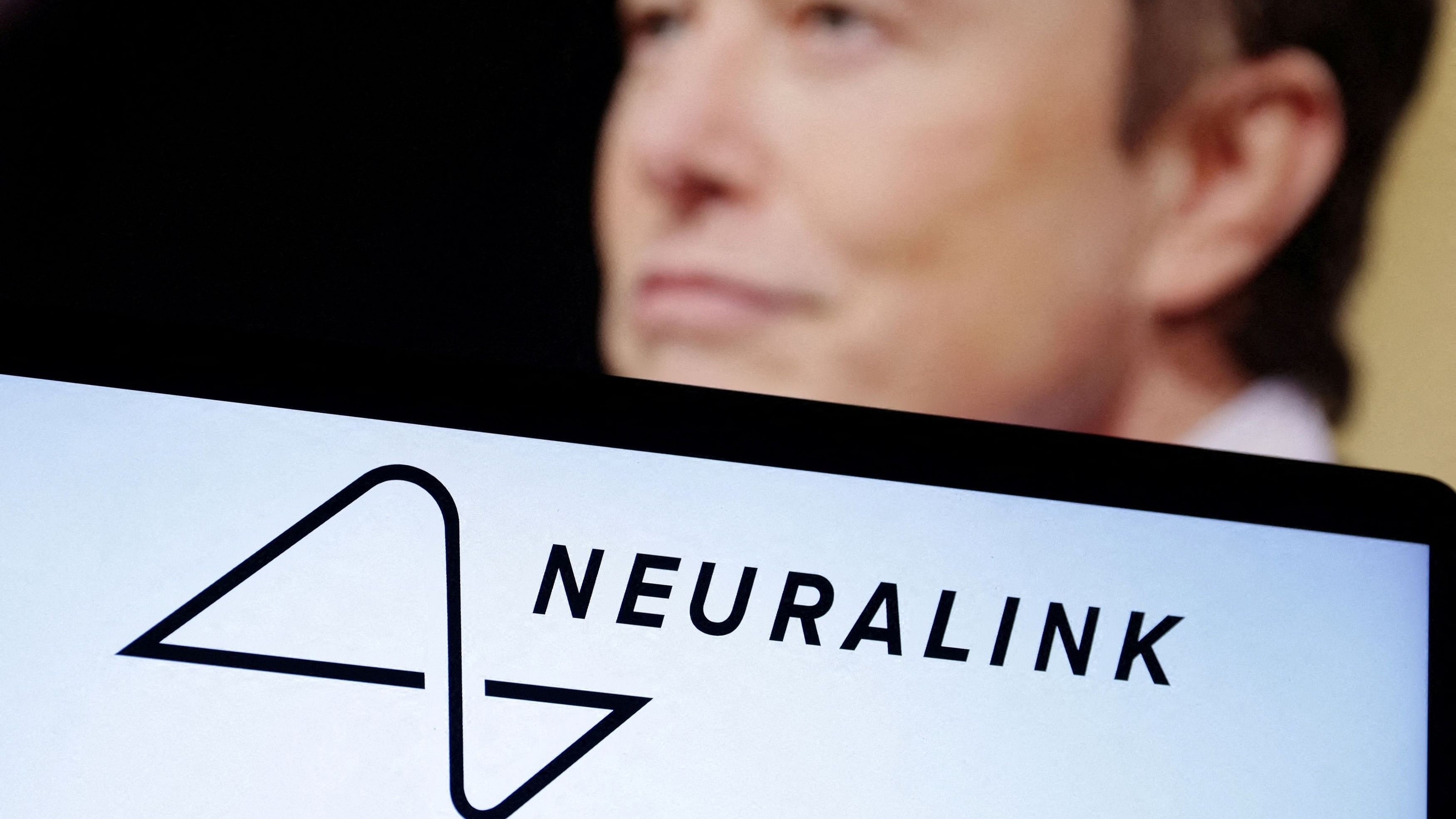<div class="paragraphs"><p>Neuralink logo and Elon Musk photo are seen in this illustration.</p></div>
