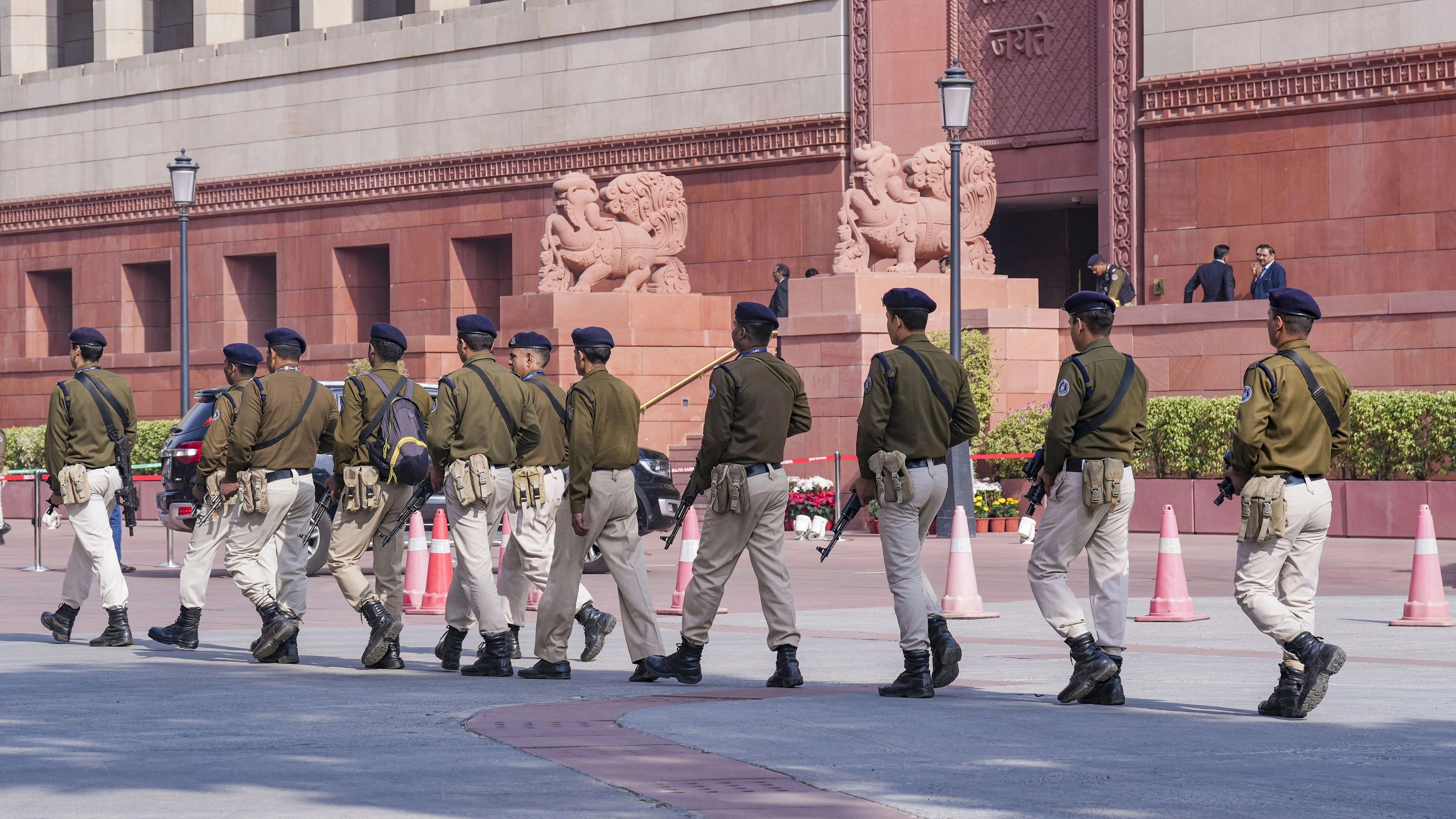 <div class="paragraphs"><p>Armed security personnel patrol the Parliament House premises after last month's security breach </p></div>