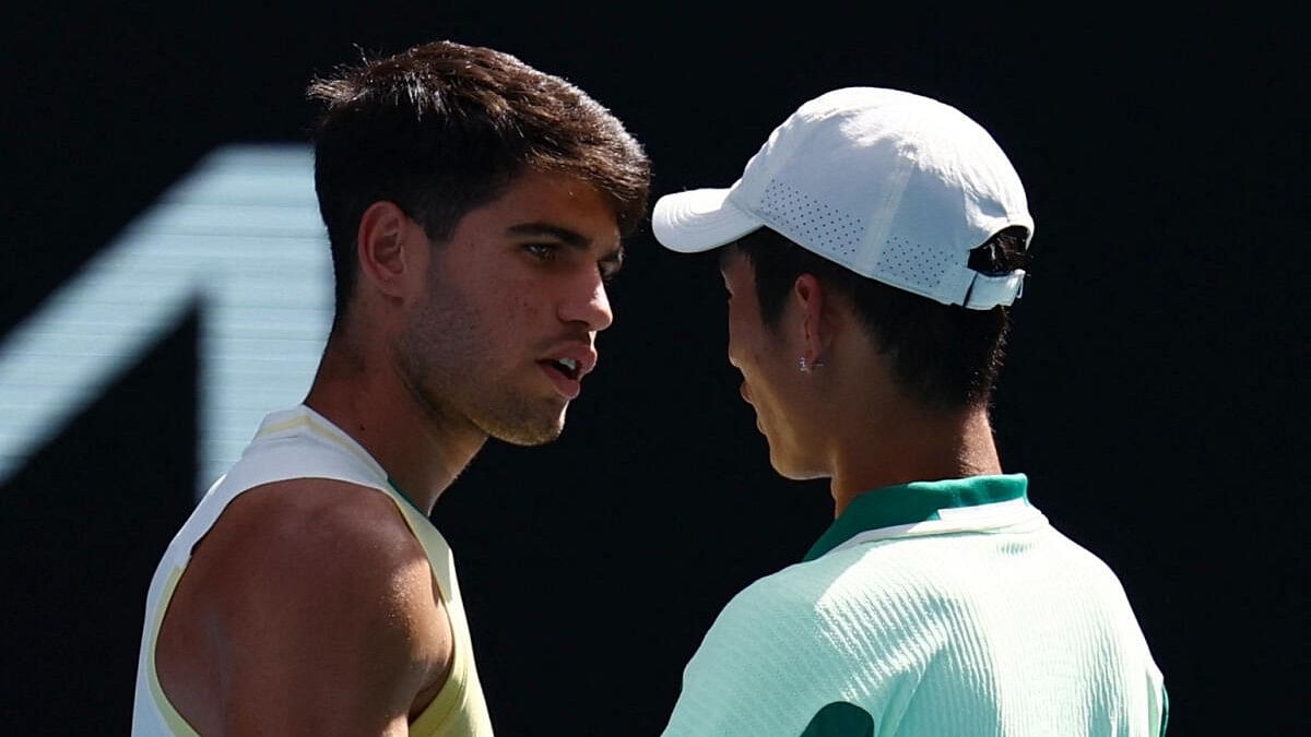 <div class="paragraphs"><p>Spain's Carlos Alcaraz with China's Shang Juncheng after Juncheng retired during their third round match.</p></div>