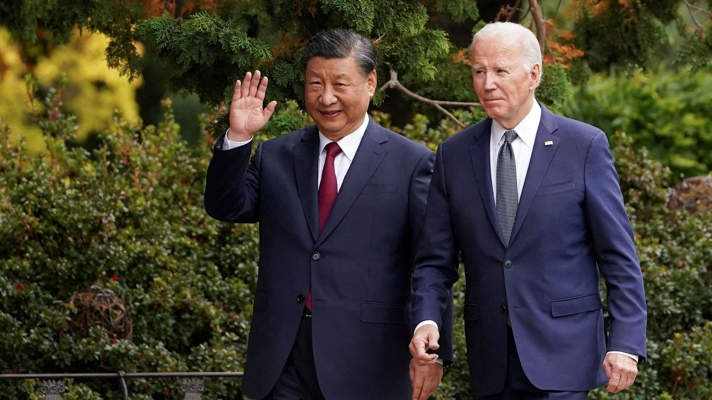<div class="paragraphs"><p>Chinese President Xi Jinping waves as he walks with U.S. President Joe Biden </p></div>