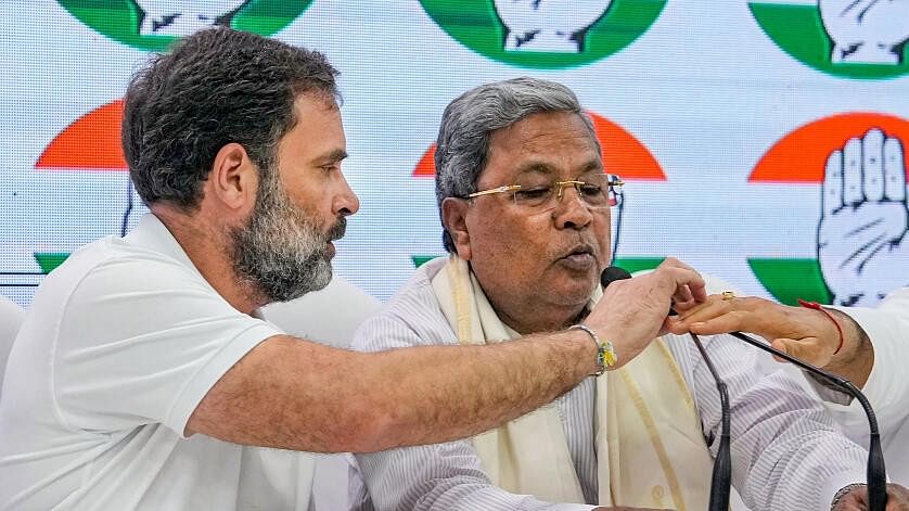 <div class="paragraphs"><p>Congress leader Rahul Gandhi with Karnataka CM Siddaramaiah</p></div>