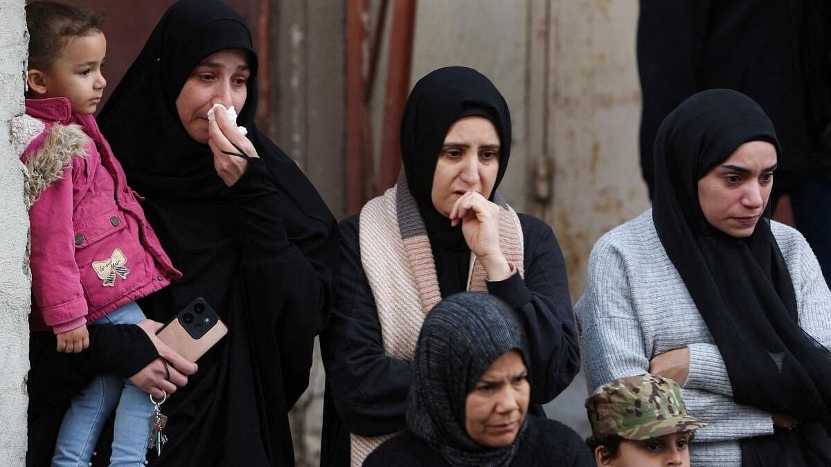 <div class="paragraphs"><p>Mourners react during the funeral of Ahmad Hammoud, who was killed along with Hamas deputy leader Saleh al-Arouri in what security sources said was an Israeli drone strike in Beirut on Tuesday, in Burj al-Shemali in Tyre, Lebanon, January 3, 2024.</p></div>