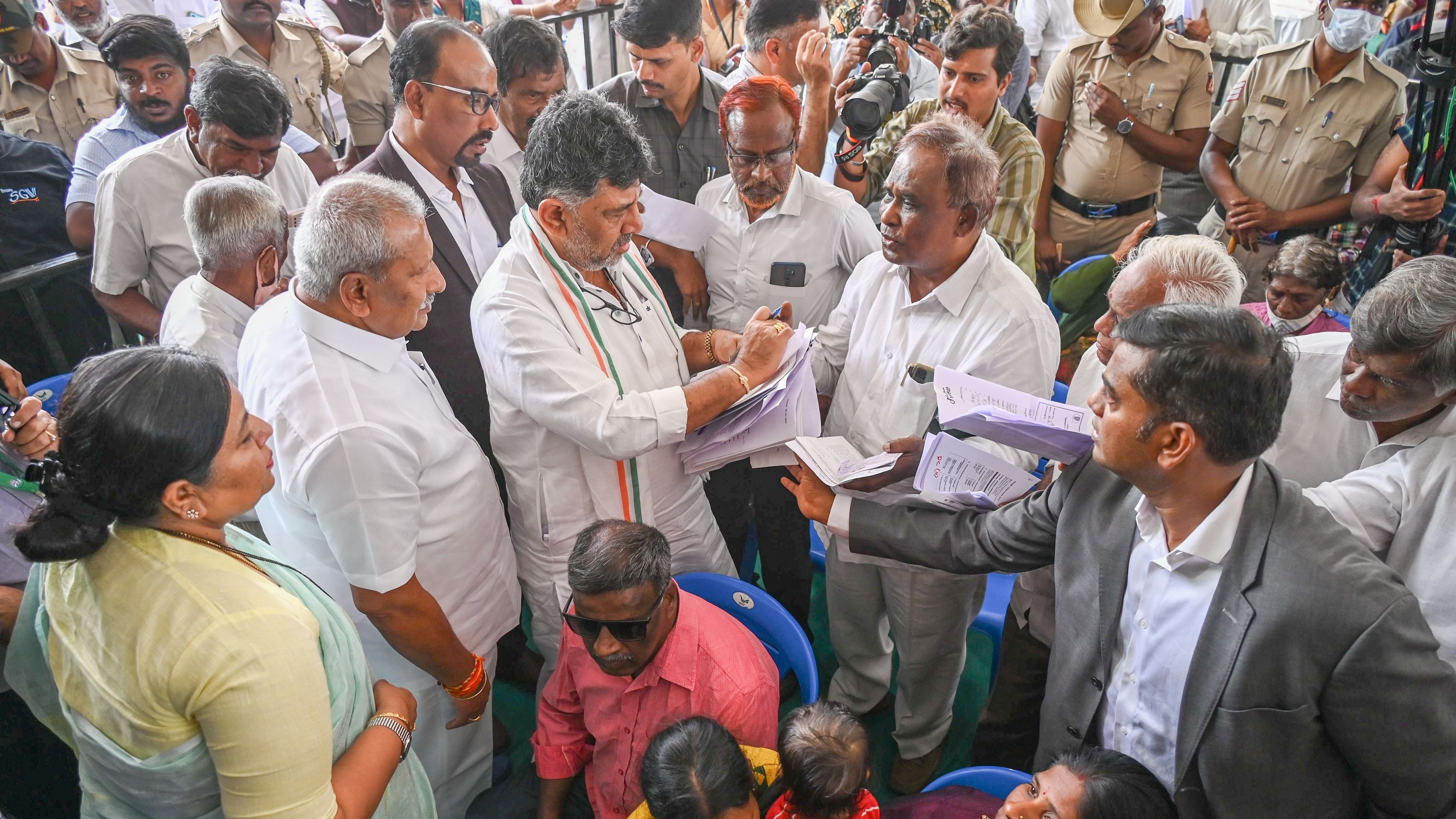 <div class="paragraphs"><p>Deputy Chief Minister DK Shivakumar collects petitions during the 'Government at your doorstep' meet conducted for the KR Puram and Mahadevapura assembly constituencies on Wednesday. </p></div>