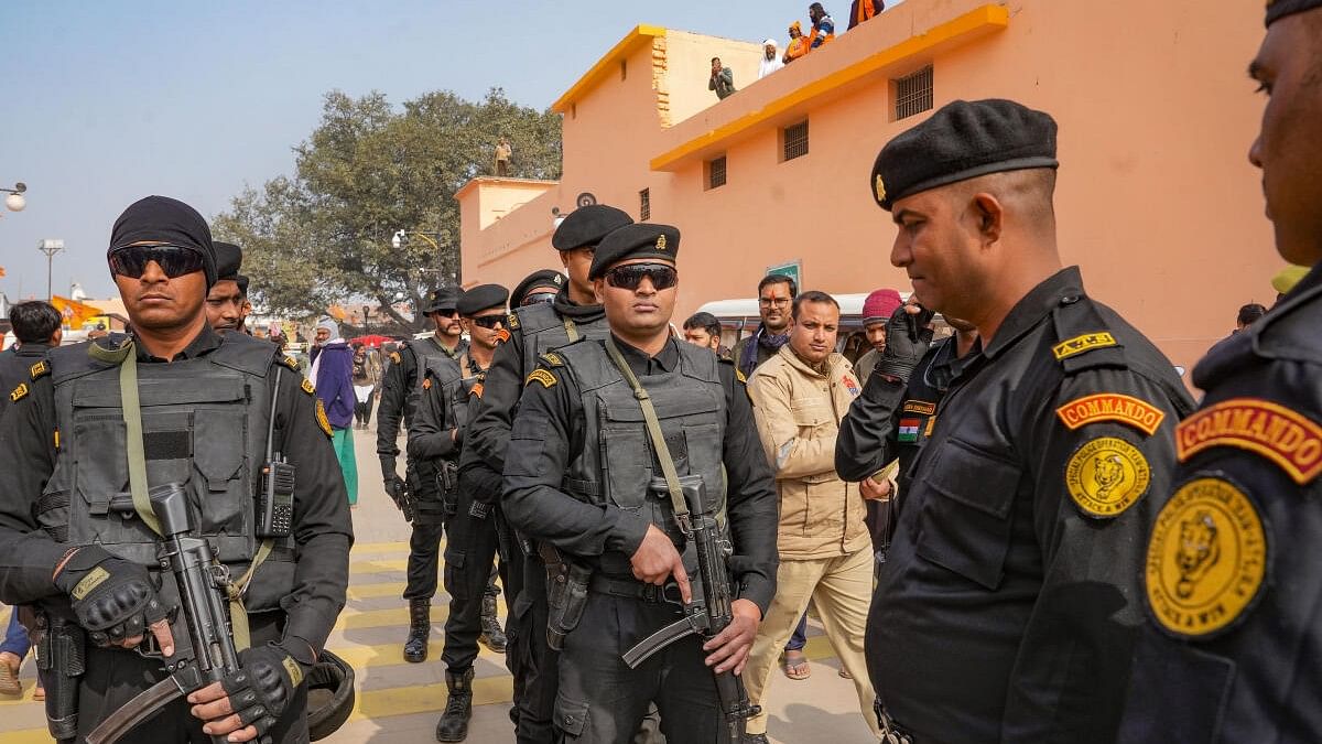 <div class="paragraphs"><p>UP Police Anti-Terrorist Squad (ATS) commandos stand guard on a road ahead of the Ram temple consecration ceremony, in Ayodhya, Sunday, Jan. 21, 2024.</p></div>