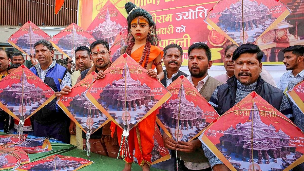 <div class="paragraphs"><p>Sindhu Sena activists with a child dressed as Lord Ram show kites depicting pictures of Ayodhya's Ram Temple before their distribution ahead of the Makar Sankranti, in Bhopal, Saturday, Jan. 13, 2024.</p></div>