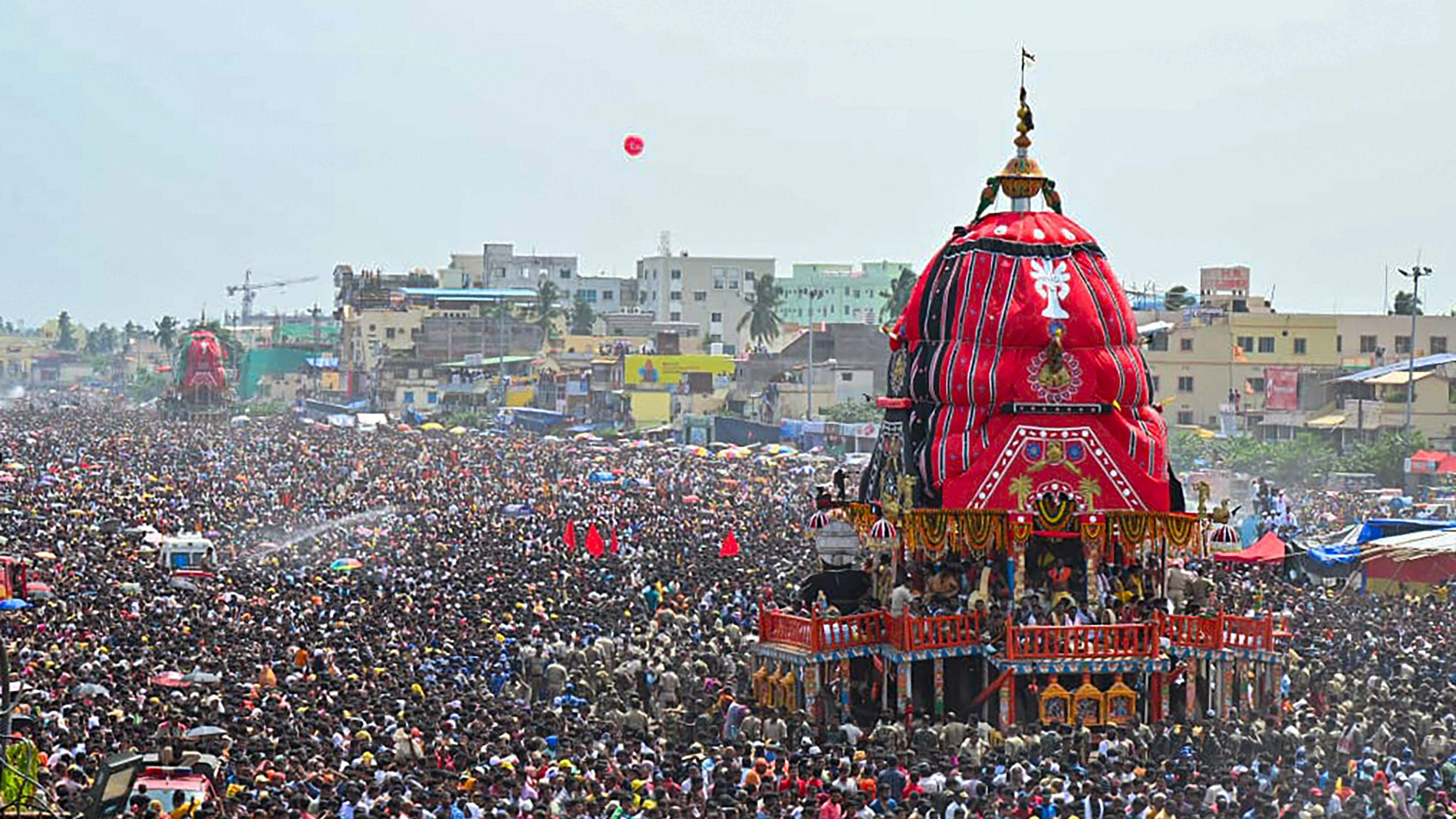 <div class="paragraphs"><p>Devotees throng chariots during the Bahuda Yatra (return car festival of Lord Jagannath), in Puri.</p></div>