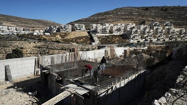 <div class="paragraphs"><p>Labourers work in a construction site in the Israeli settlement of Ramat Givat Zeev in the occupied-West Bank</p></div>