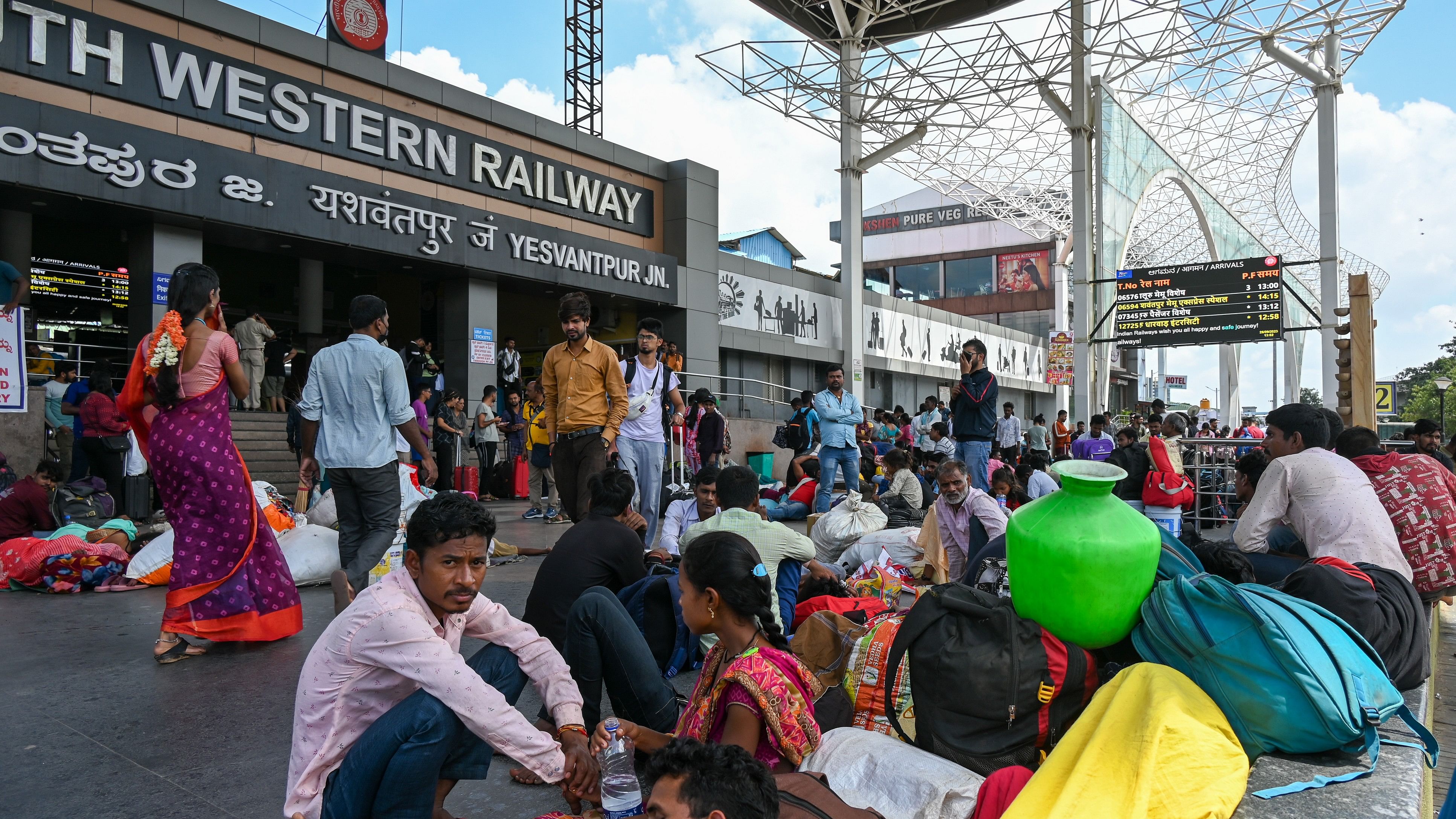 <div class="paragraphs"><p>People with their luggage at Yeshwanthpura Railway station.&nbsp;</p></div>