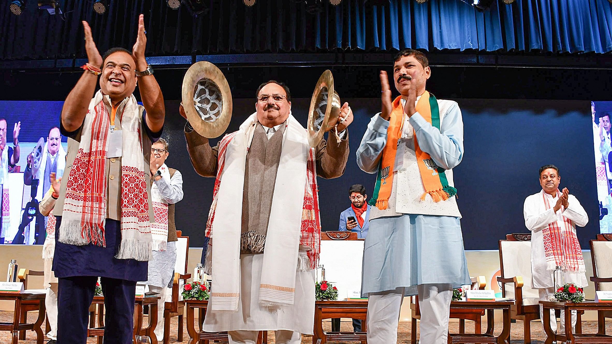 <div class="paragraphs"><p>BJP National President JP Nadda play 'Taal, an Assamese instrument, during the party's Assam Pradesh Executive Meeting, in Guwahati, Wednesday, Jan. 10, 2024. Assam Chief Minister Himanta Biswa Sarma and  state BJP President Bhabesh Kalita are also seen.   </p></div>