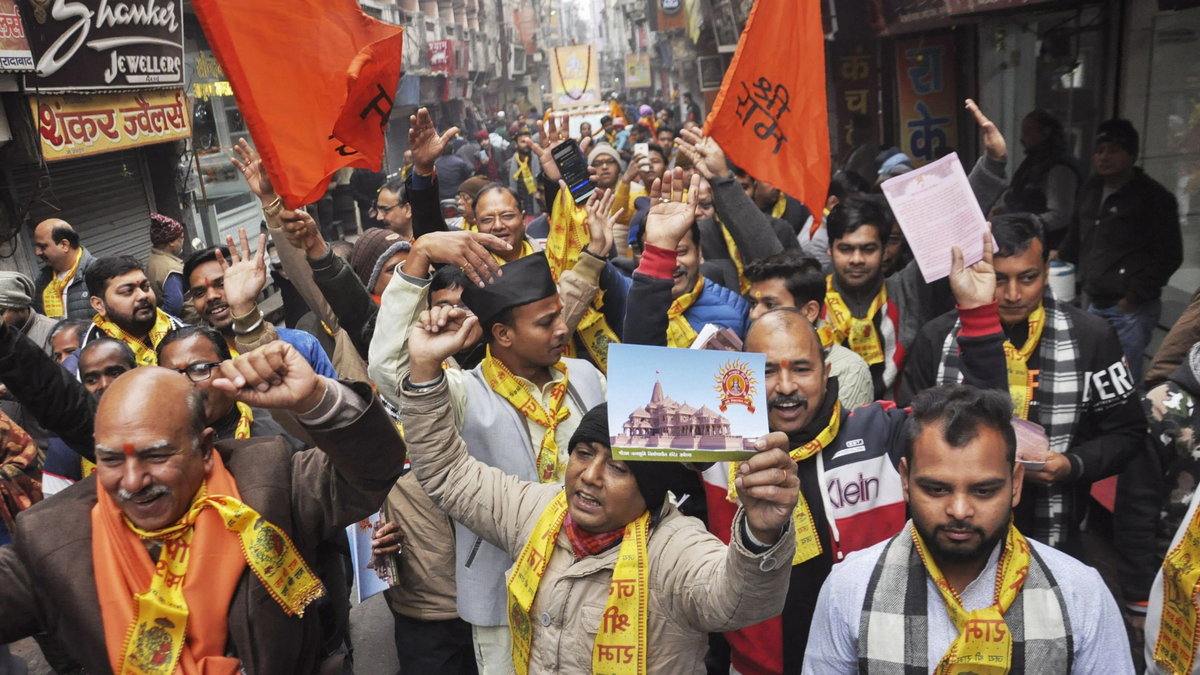 <div class="paragraphs"><p>Devotees during distribution of akshat, rice grains mixed with turmeric and ghee, ahead of the consecration ceremony at Shri Ram Janambhoomi Temple.</p></div>