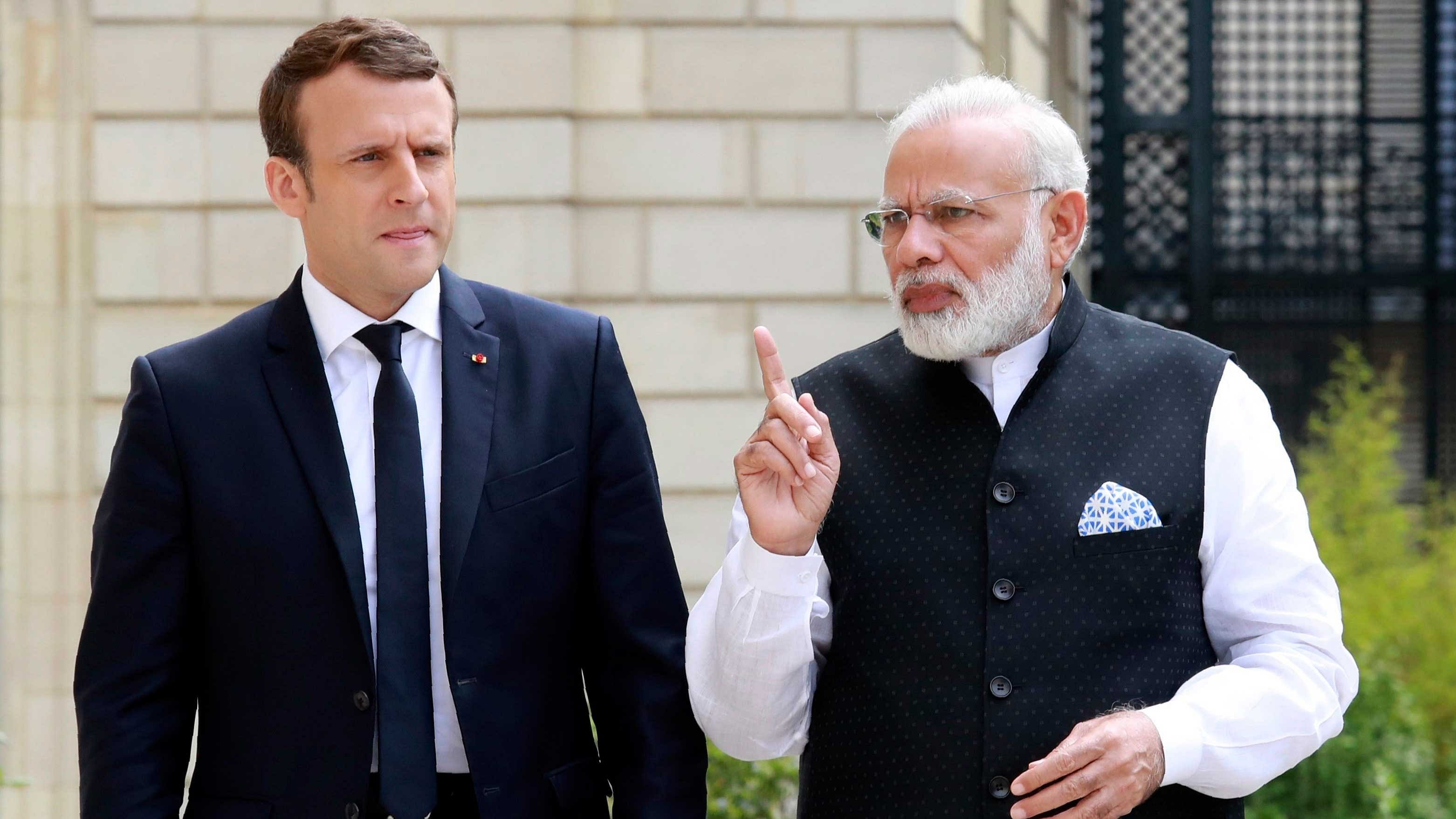 <div class="paragraphs"><p>French President Emmanuel (L) Macron and Prime Minister Narendra Modi (R).</p></div>