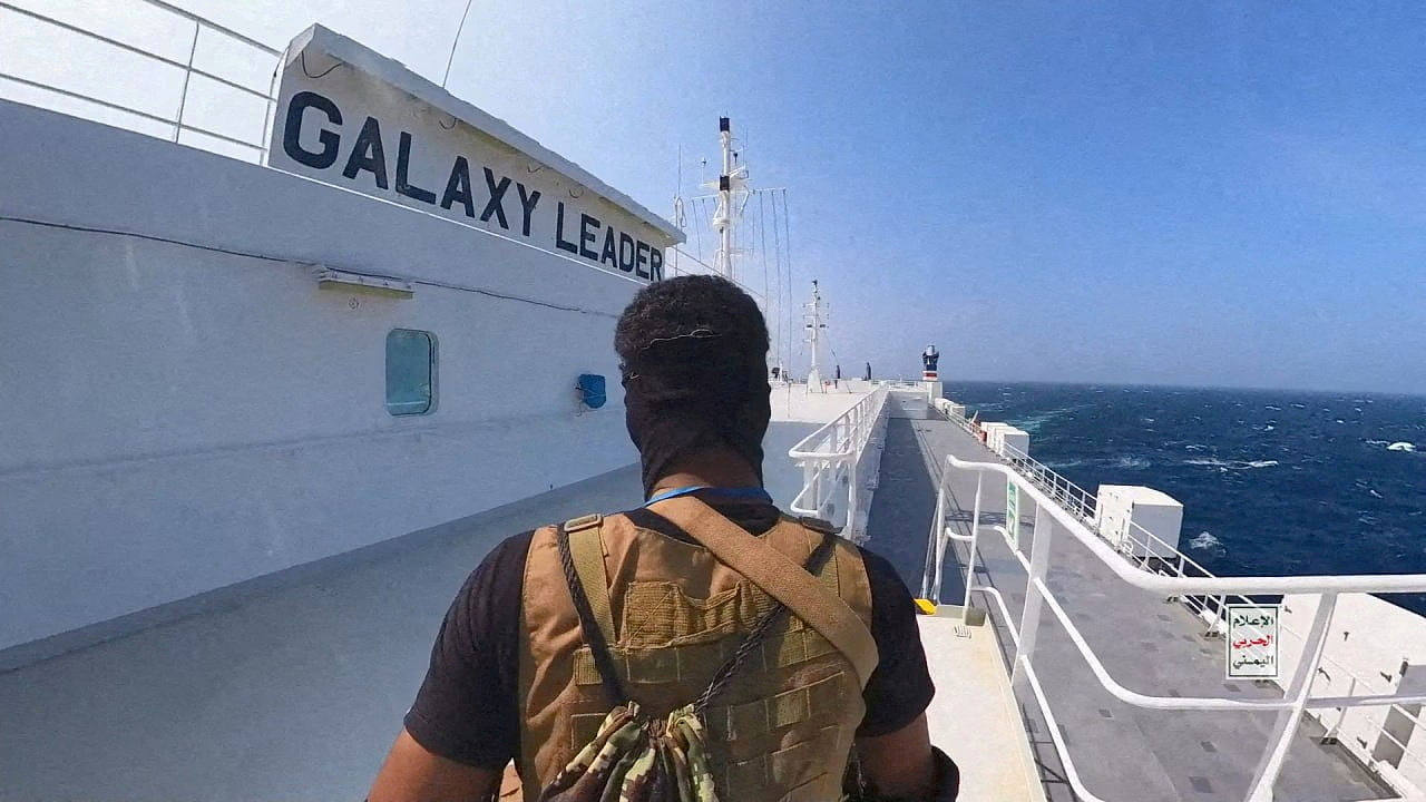 <div class="paragraphs"><p>A Houthi fighter stands on the Galaxy Leader cargo ship in the Red Sea in this photo released November 20, 2023.</p></div>