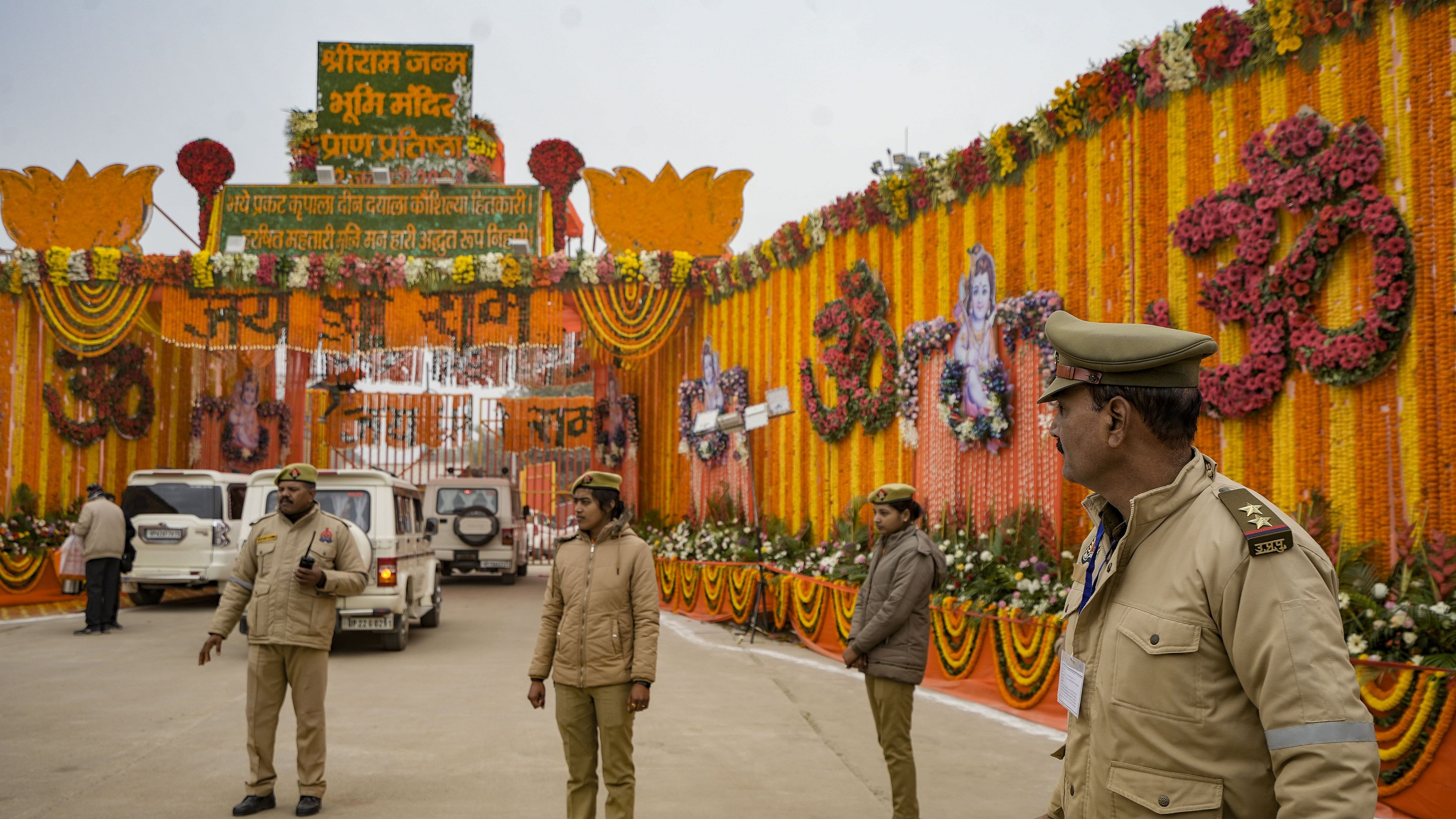 <div class="paragraphs"><p>Police personnel stand guard near the entrance to the Ram temple ahead of the consecration ceremony, in Ayodhya, Sunday.</p></div>