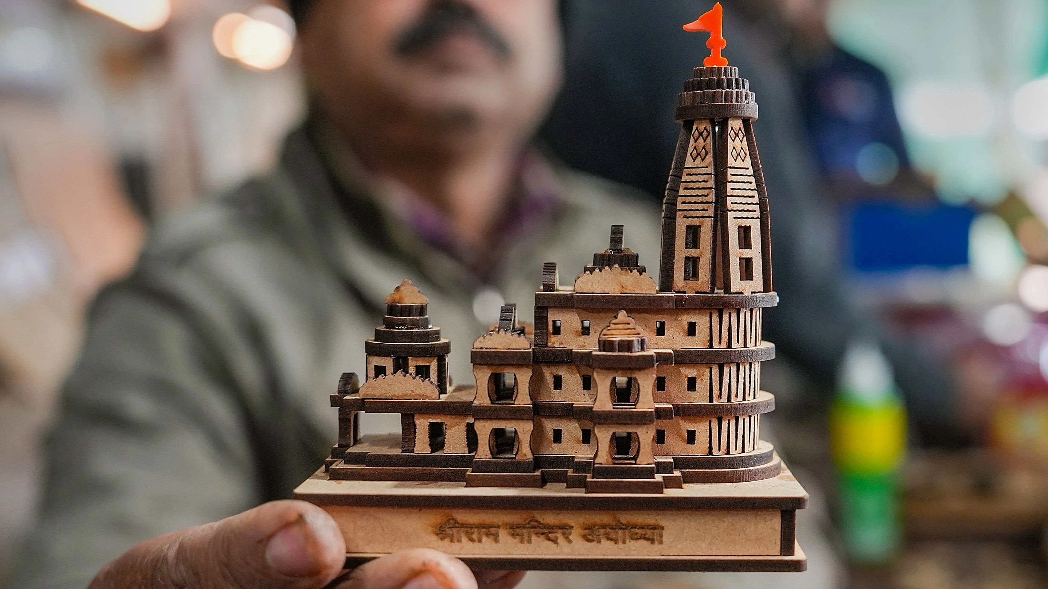 <div class="paragraphs"><p>A staffer at a manufacturing unit displays a model of the Shri Ram Janmabhoomi Temple, at Faizabad in Ayodhya district.</p></div>