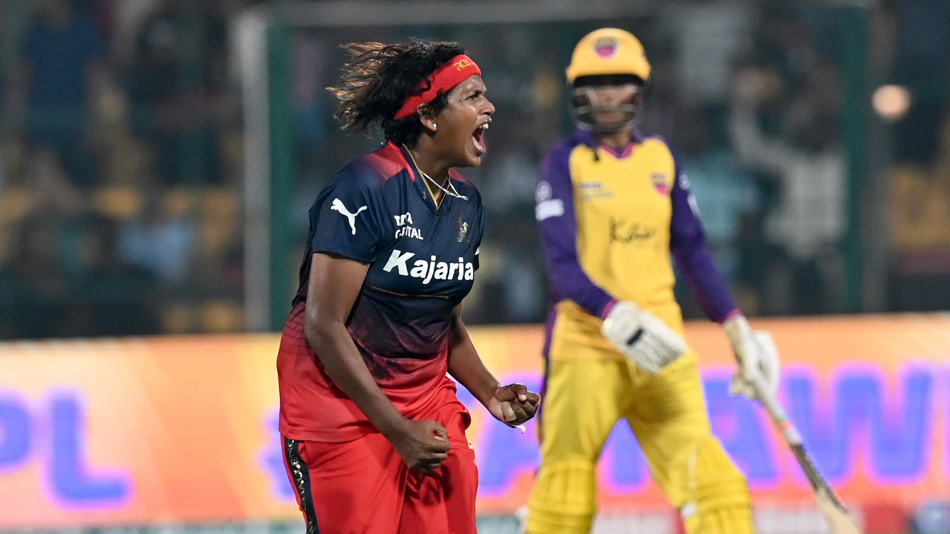 <div class="paragraphs"><p>RCB's Asha&nbsp;Sobhana celebrates after taking a UP Warriorz's&nbsp;wicket Navgire in Bengaluru on Saturday. </p></div>